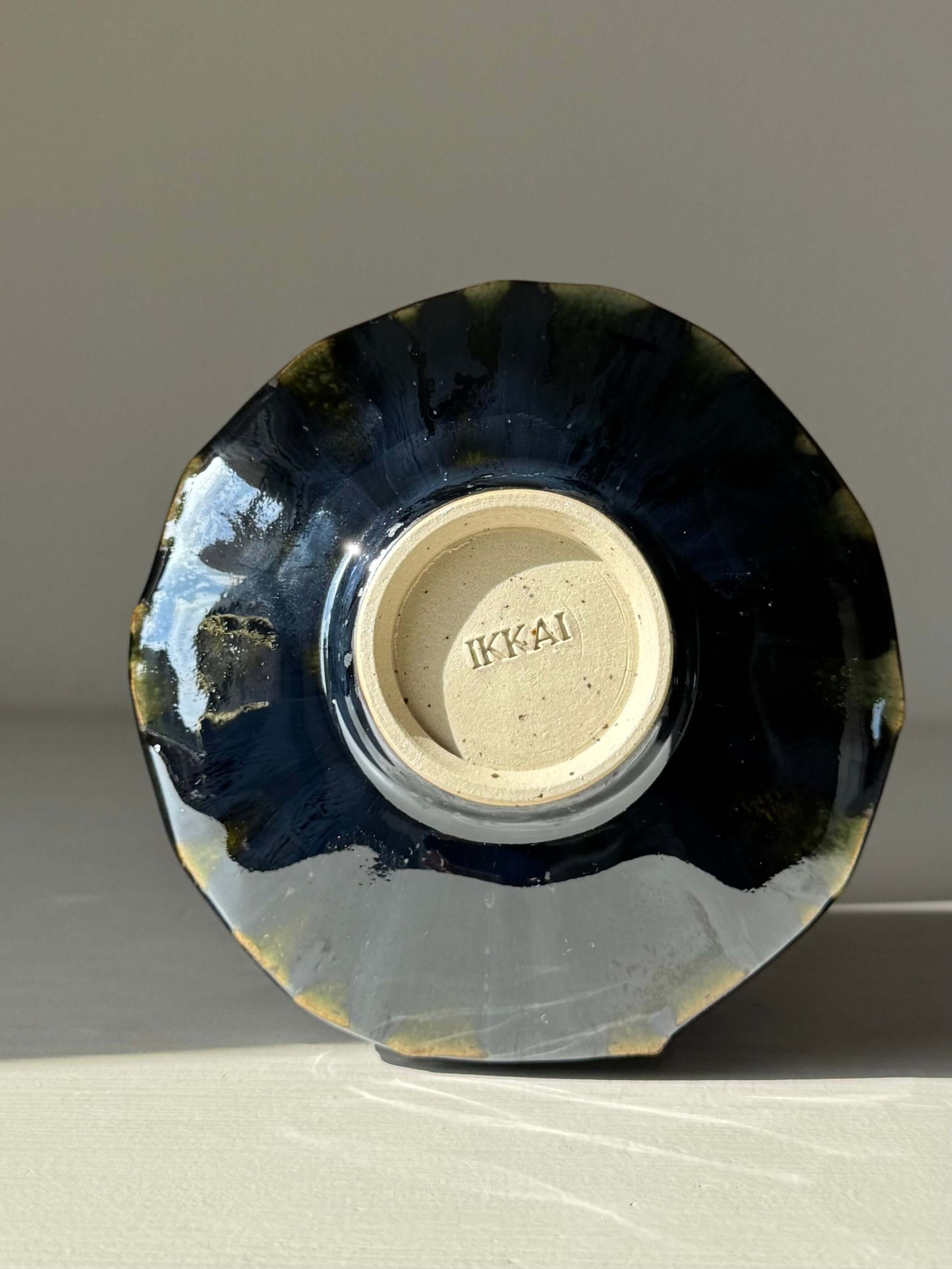Bottom view of the Textured Matcha Bowl - Hinoki Series #07, showcasing handmade ceramic design and unique glaze finish.