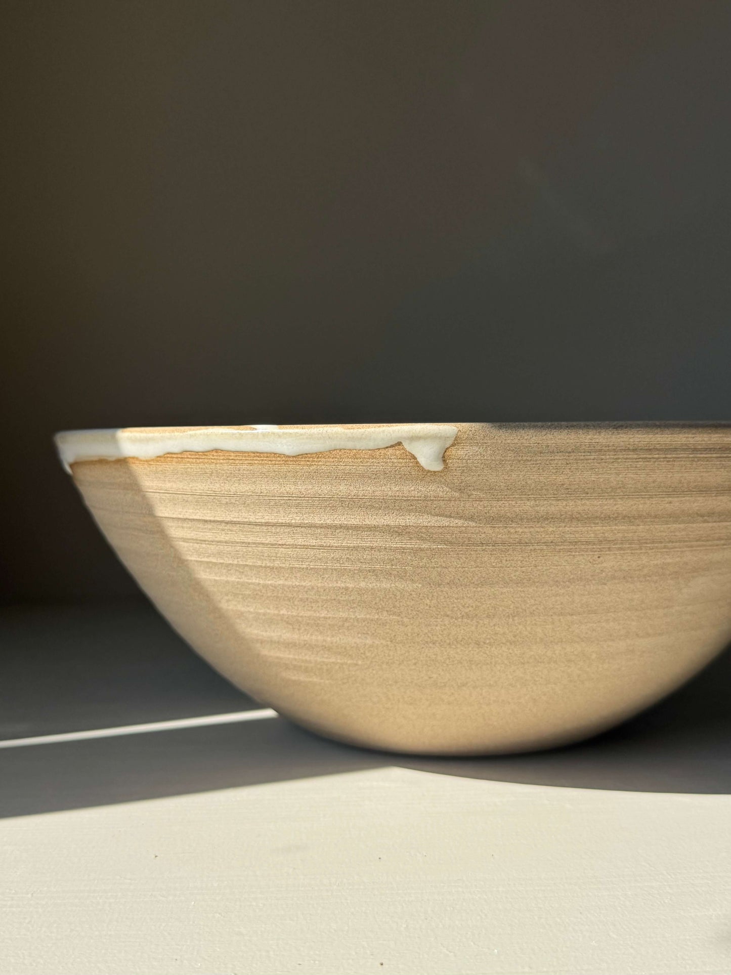 Handmade ceramic Large Bowl - Yuki Series with white glaze dripping over raw clay, ideal for generous servings and calm table moments.