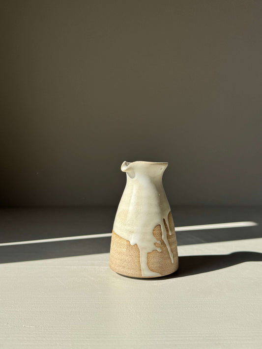 Handmade ceramic Soya Pourer - Yuki Series with flowing white glaze on toffee clay, elegantly shaped for subtle pouring moments.