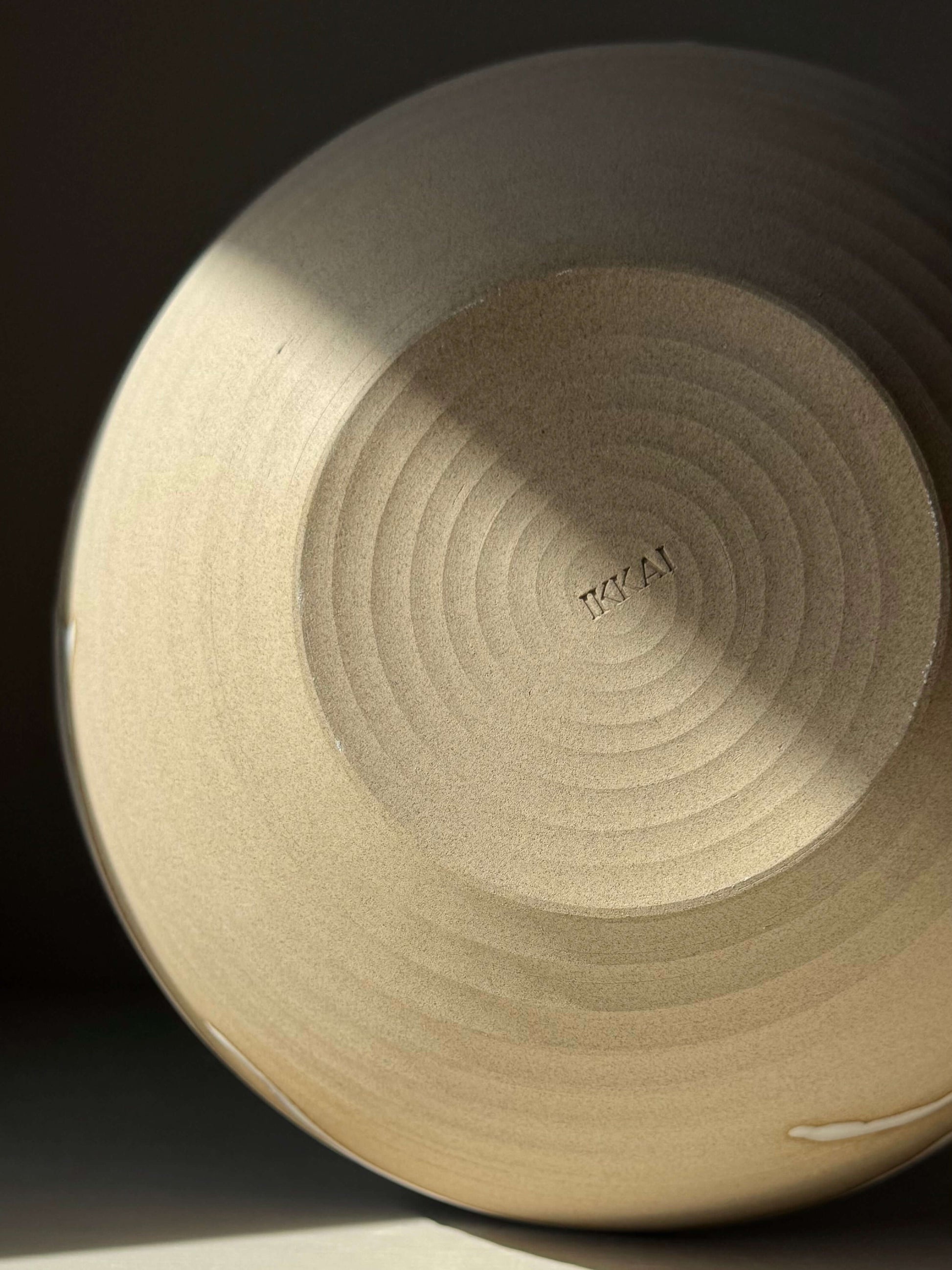 Handmade ceramic Medium Bowl - Yuki Series #02 with raw toffee-colored clay exterior and glossy white glaze accents
