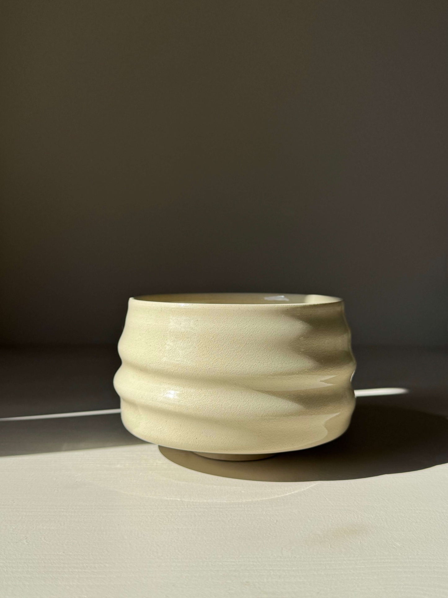 Handmade ceramic Matcha Bowl - Clear Glaze #01 with natural ridges and wide foot, highlighting soft simplicity and gentle warmth.