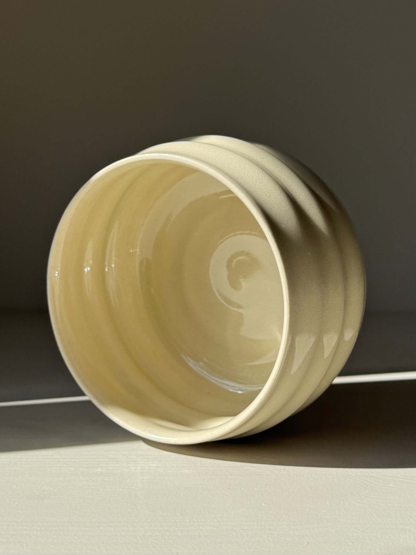 Handmade ceramic Matcha Bowl - Clear Glaze #01 with natural stoneware finish, featuring carved ridges and a glowing clear glaze.