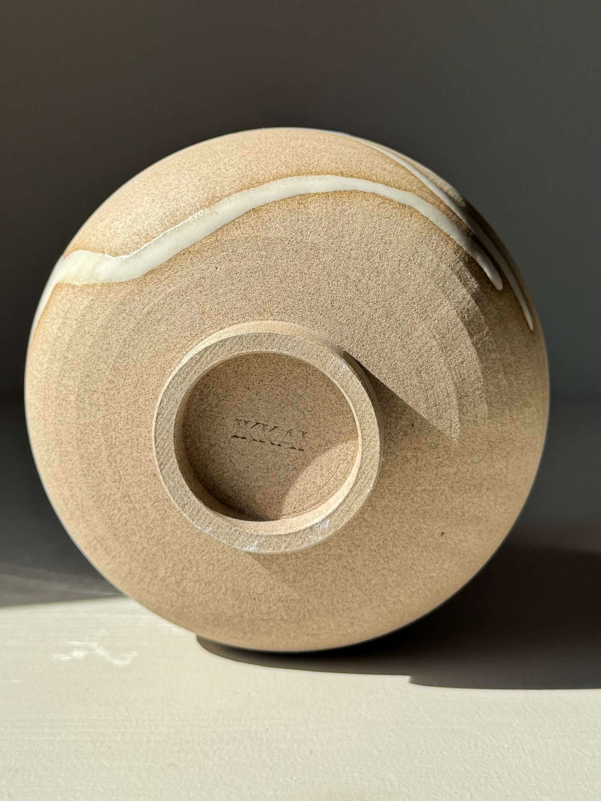 Base view of Matcha Bowl – Yuki Series #02, featuring handmade ceramic design with toffee clay and white glaze.