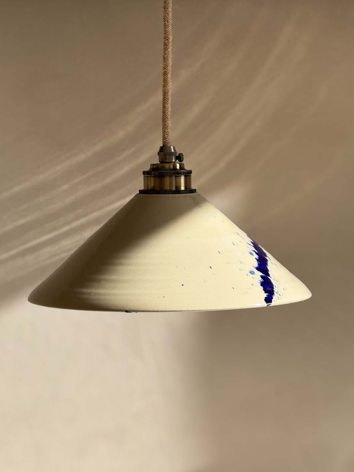 Handmade Ceramic Lamp Shade – Gosu Series #01 with cobalt blue accents on display, featuring unique hand-crafted design.
