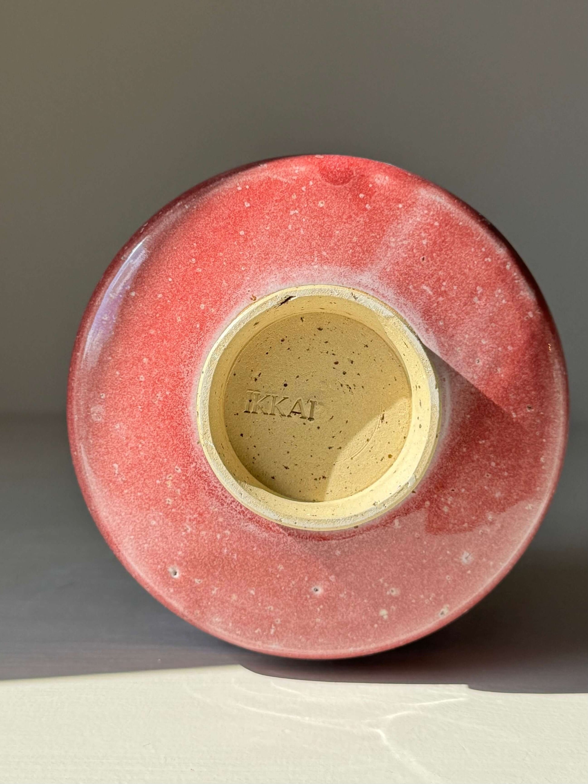 Bottom view of Matcha Bowl - Ume Series #01 in handmade ceramic, showcasing unique ridges and Ume blossom-inspired design.
