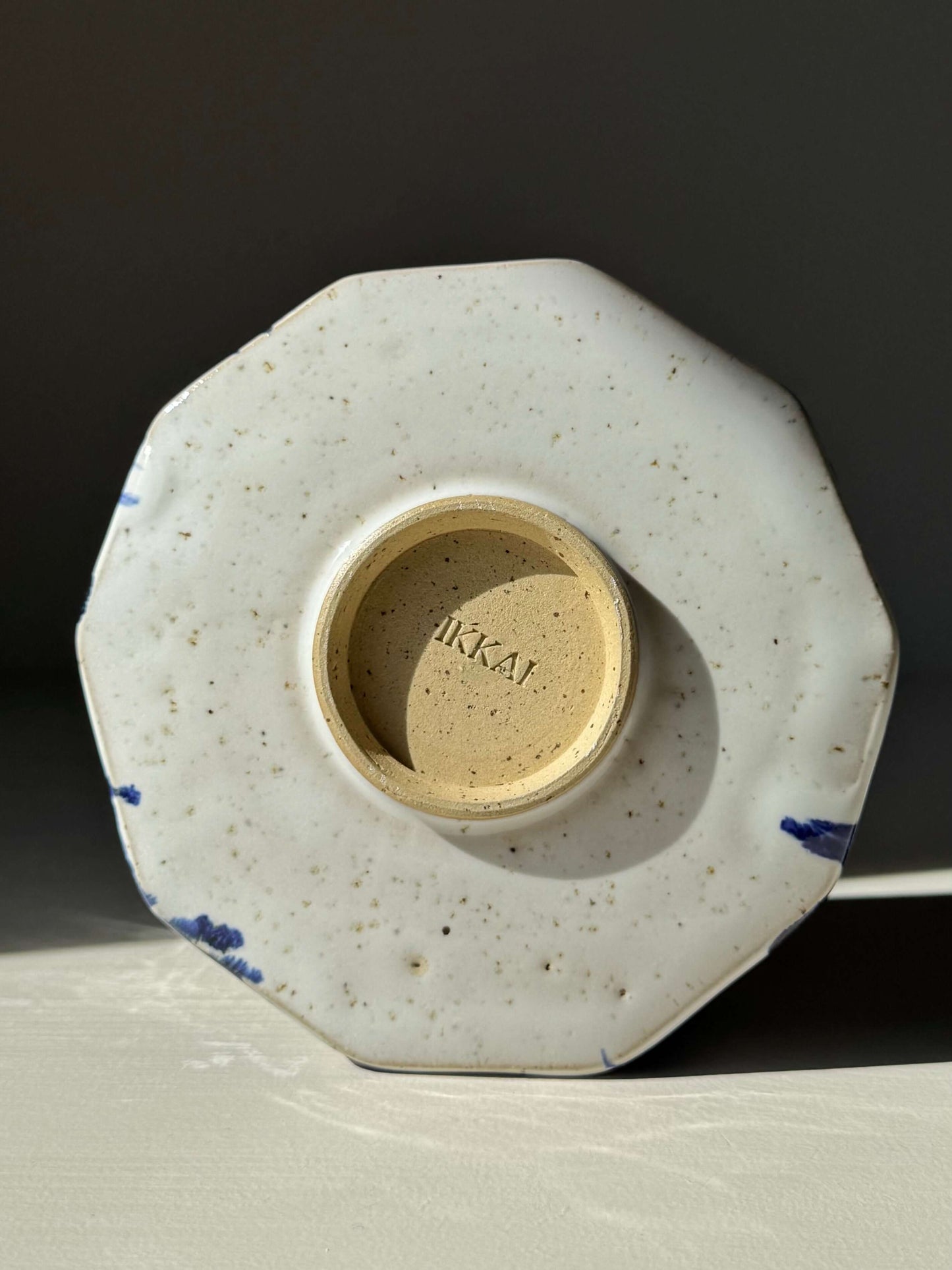 Bottom view of Faceted Matcha Bowl – Cobalt Blue & Glossy White Glaze #03, showing handcrafted ceramic detail, cobalt accents visible.