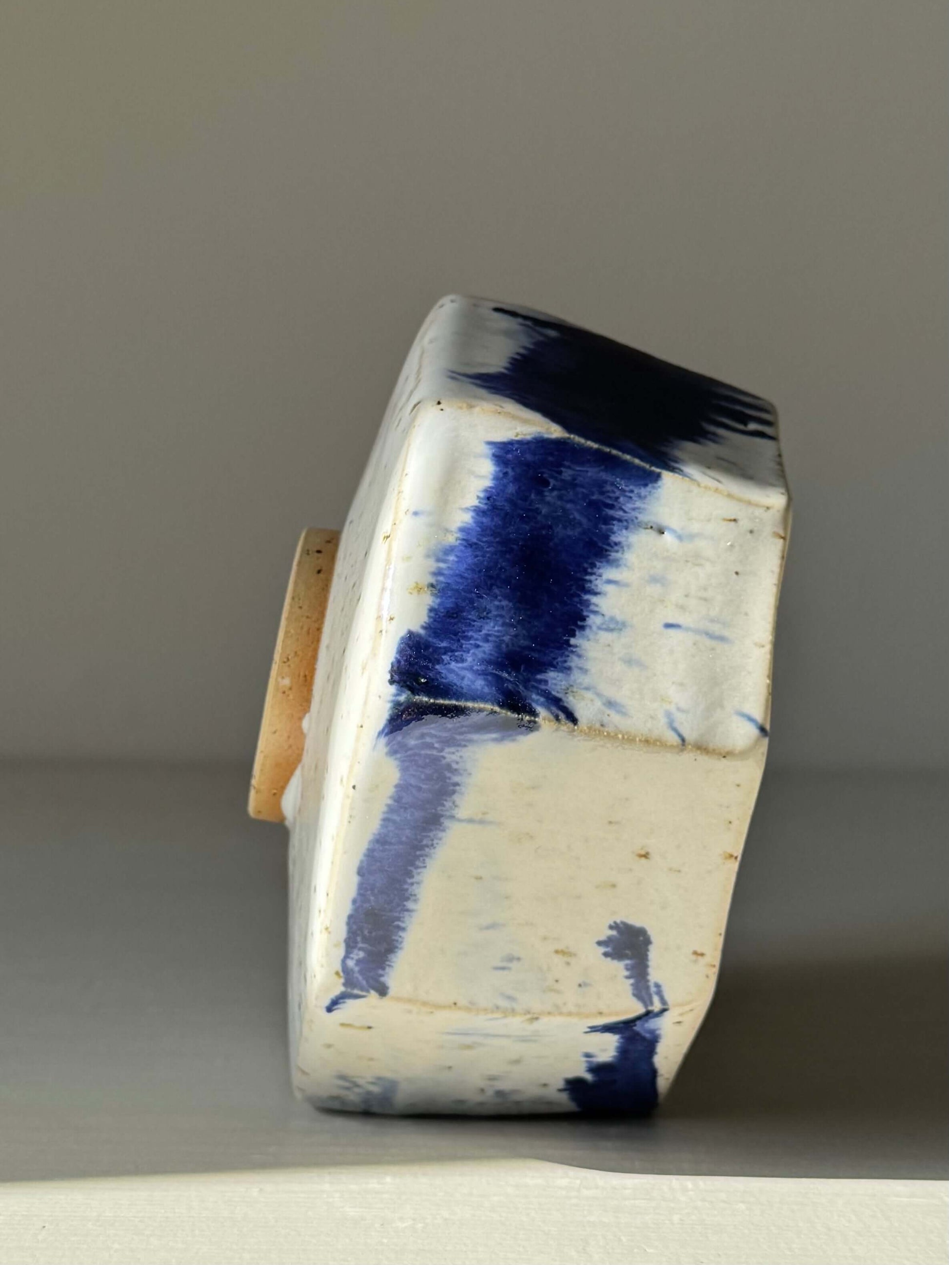 Handmade ceramic Faceted Matcha Bowl – Cobalt Blue & Glossy White Glaze #05, featuring a unique faceted design and cobalt blue accents.