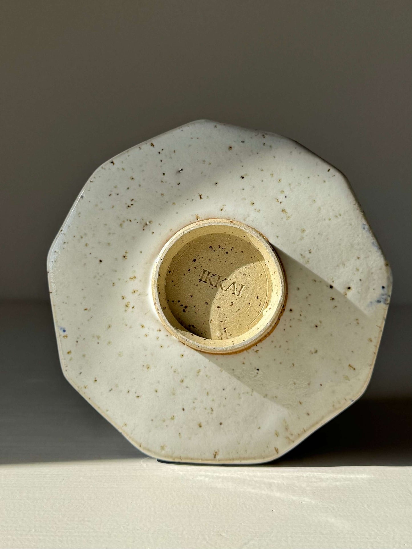Bottom view of handmade ceramic Faceted Matcha Bowl – Cobalt Blue & Glossy White Glaze #05 with textured facets.