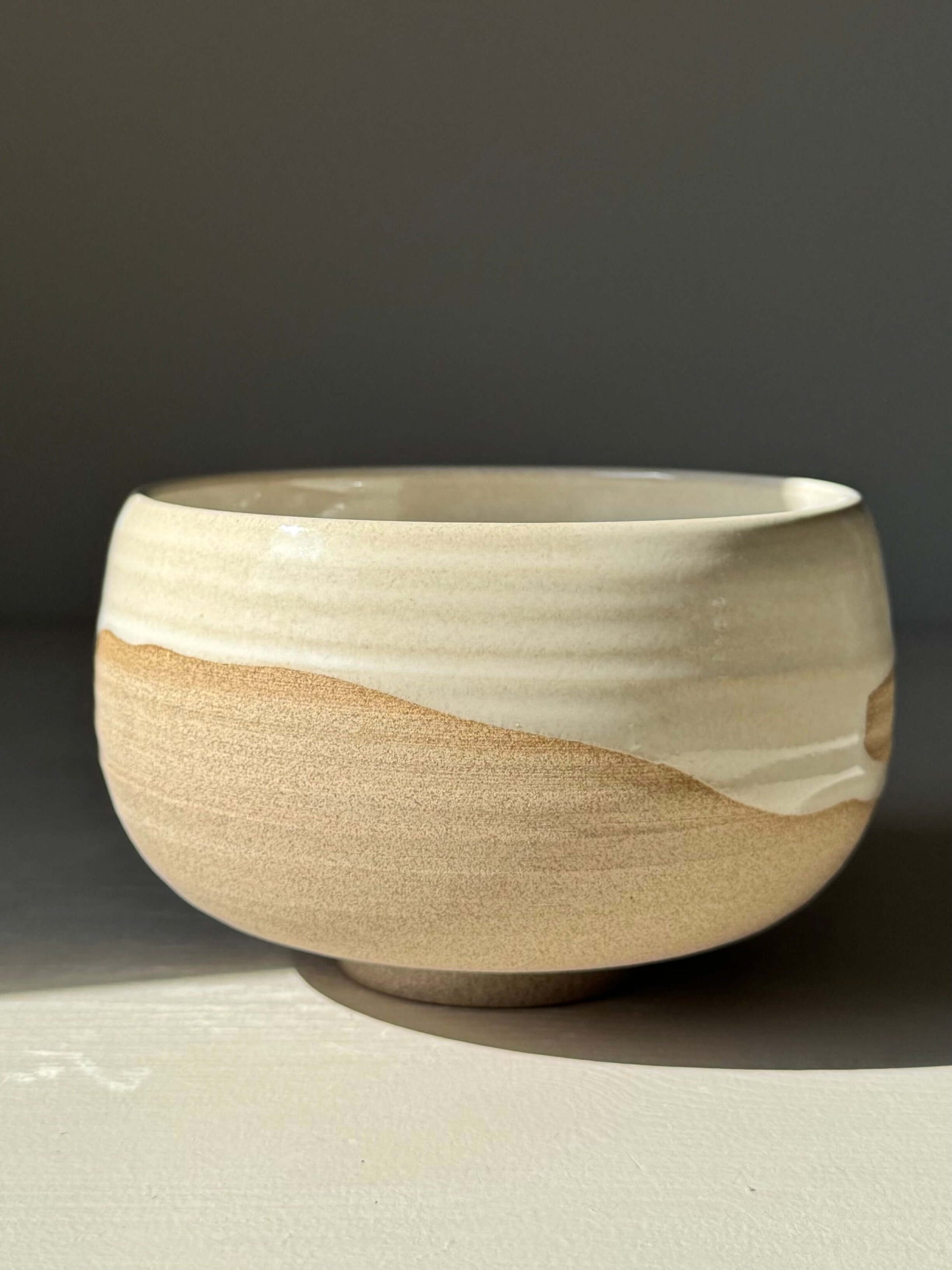 Handmade ceramic Matcha Bowl – Yuki Series #06 with toffee clay and glossy white glaze, unique artisanal design.