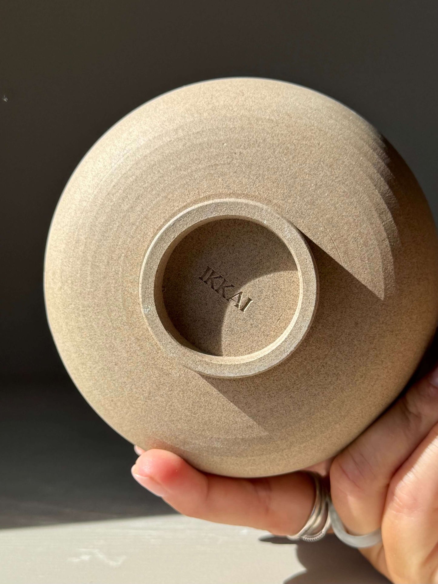 Bottom view of Matcha Bowl – Yuki Series #03, showcasing the handmade ceramic detail and textured toffee clay.