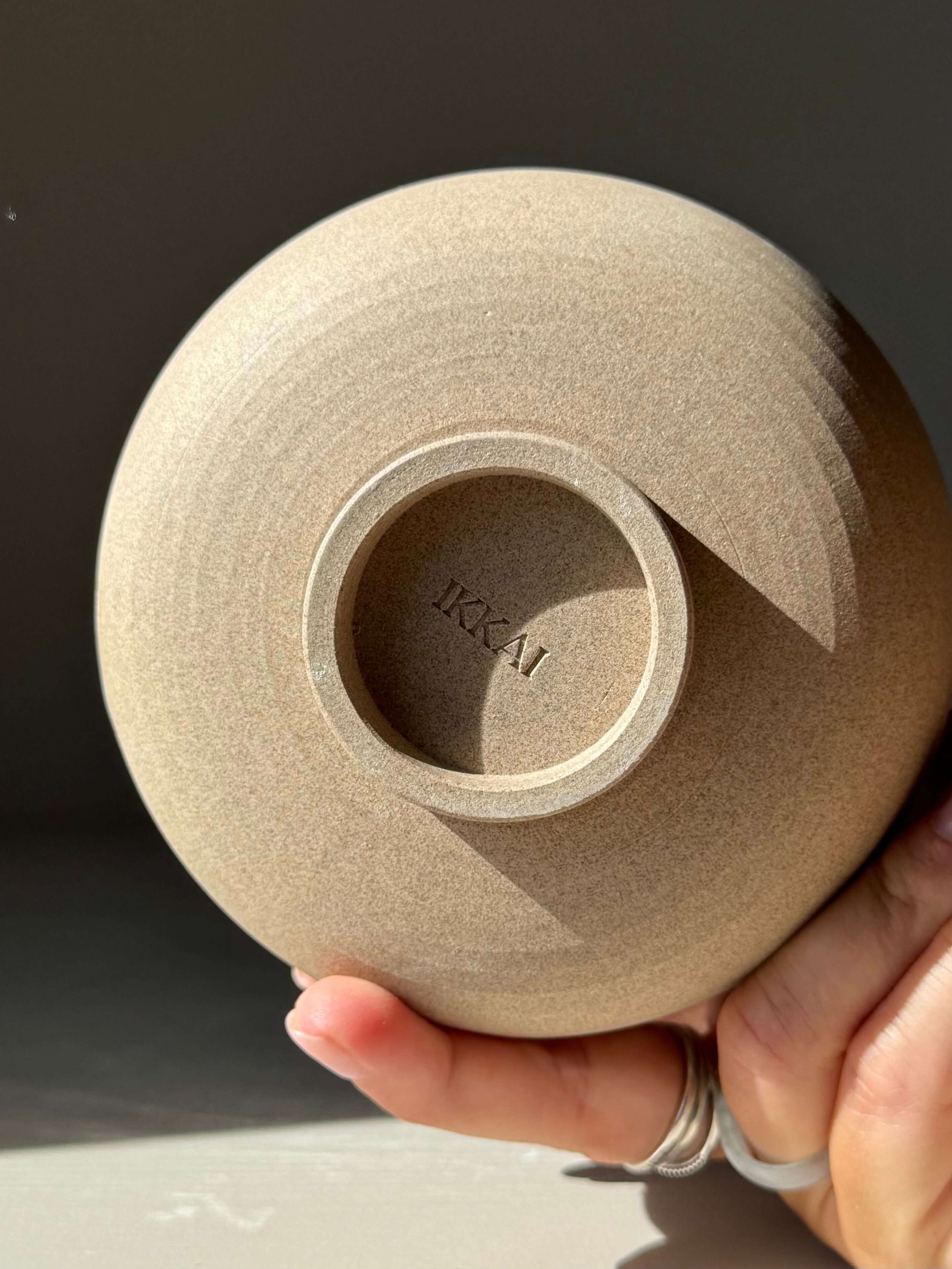 Bottom view of Matcha Bowl – Yuki Series #03, showcasing the handmade ceramic detail and textured toffee clay.