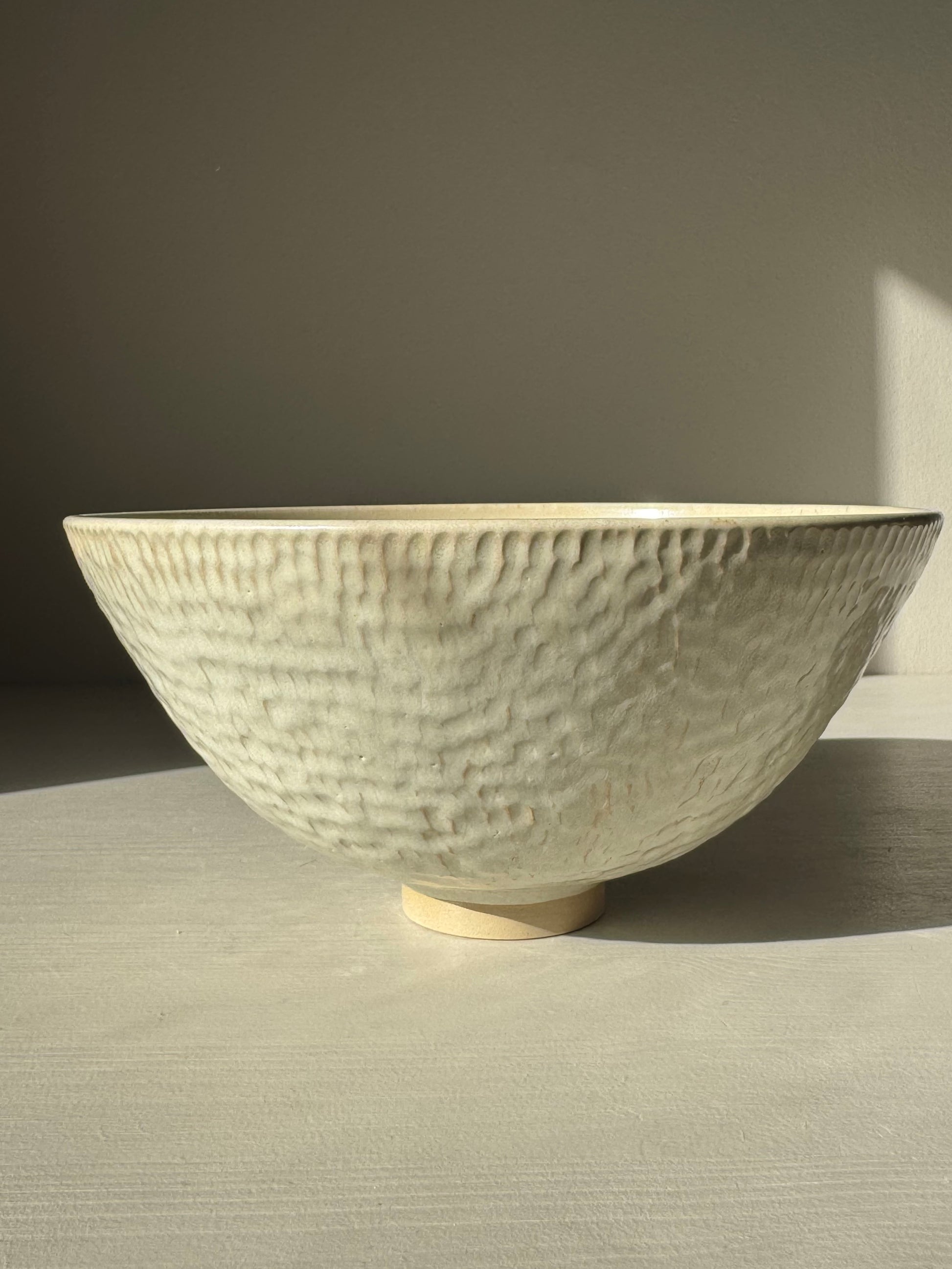 Medium Bowl – Moonstone with creamy satin glaze and hand-carved texture, ideal for adding elegance to any table setting.