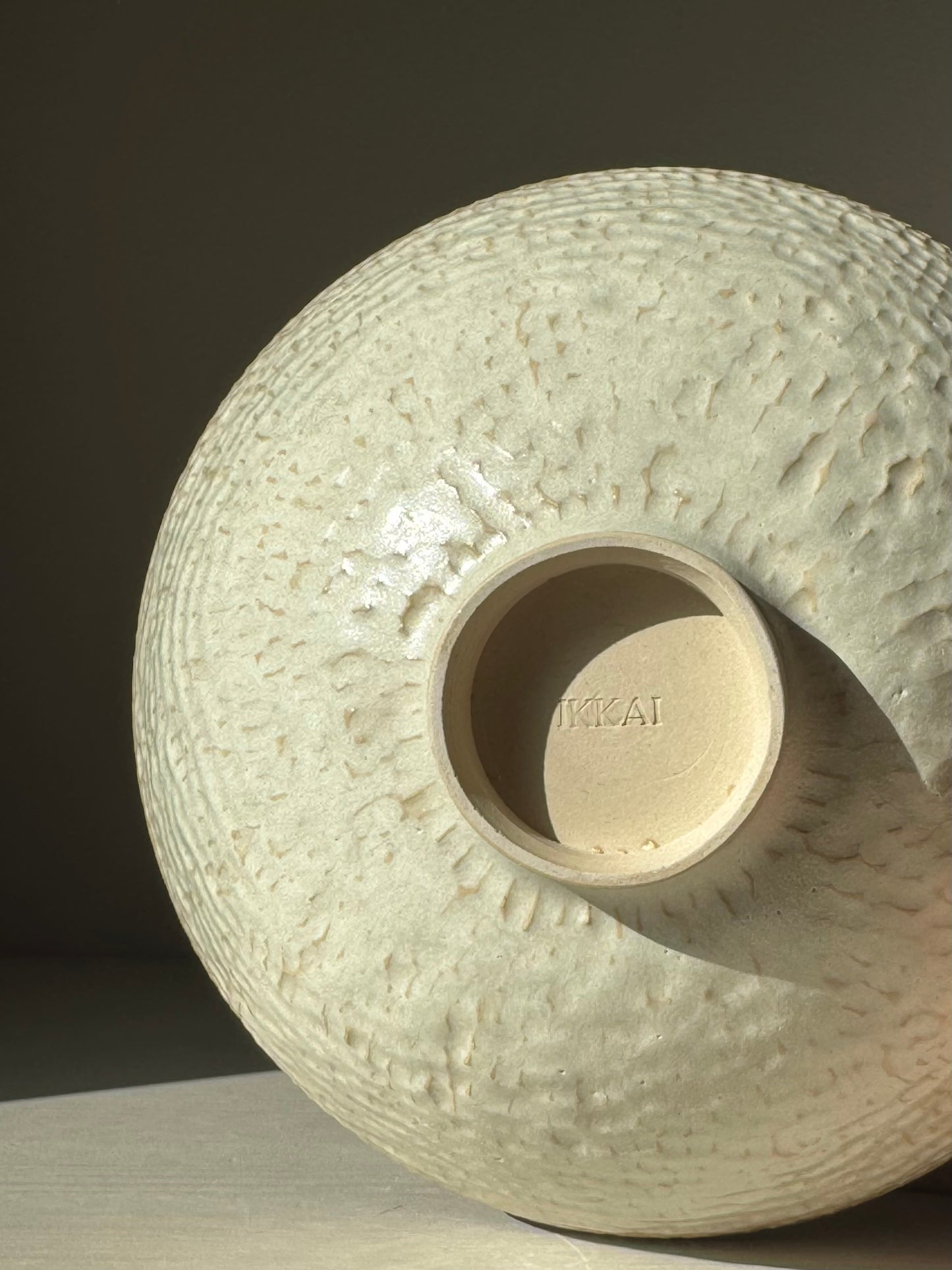 Medium Bowl – Moonstone with hand-carved texture and creamy satin glaze capturing light beautifully.
