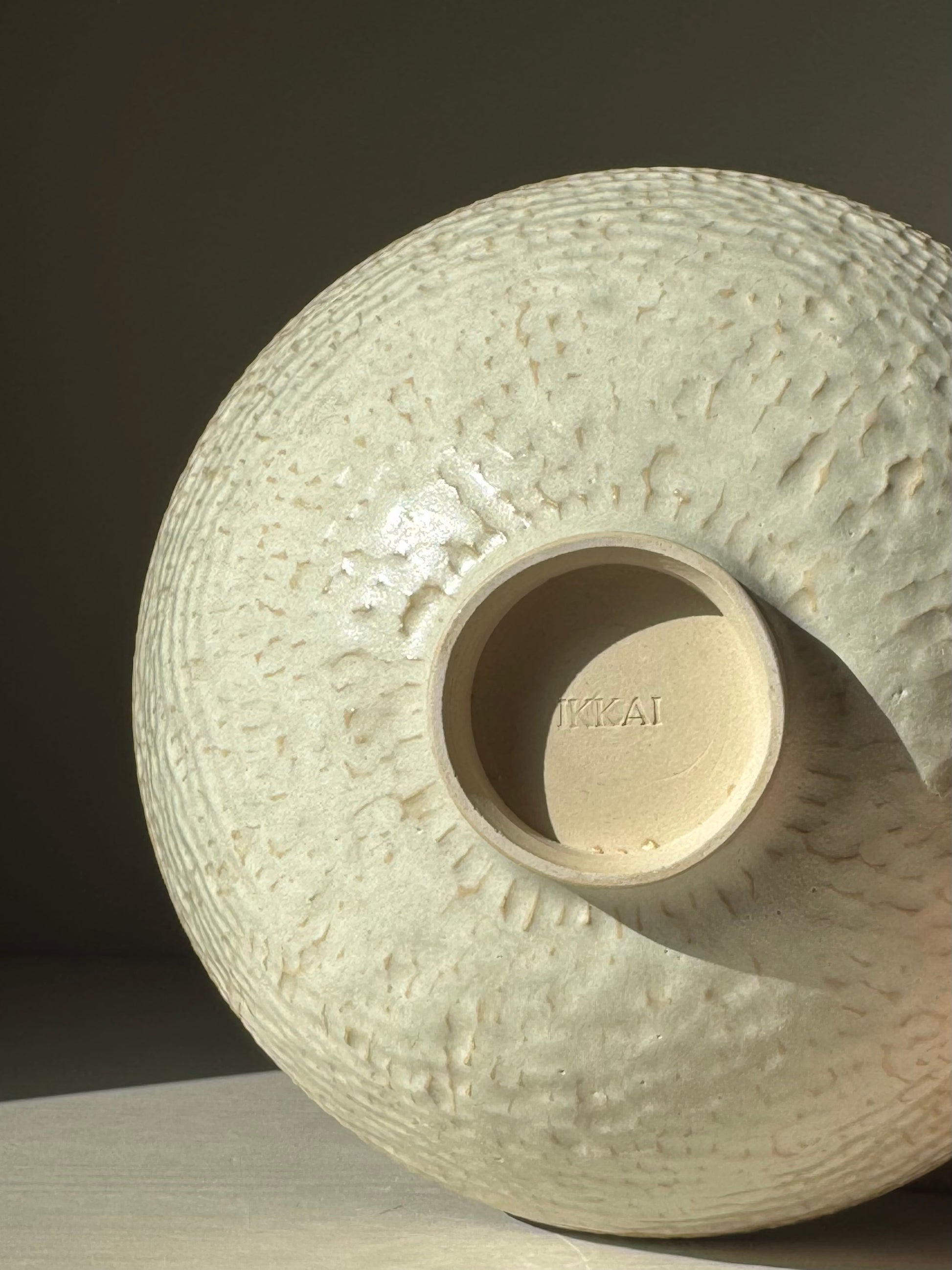 Medium Bowl – Moonstone with hand-carved texture and creamy satin glaze capturing light beautifully.