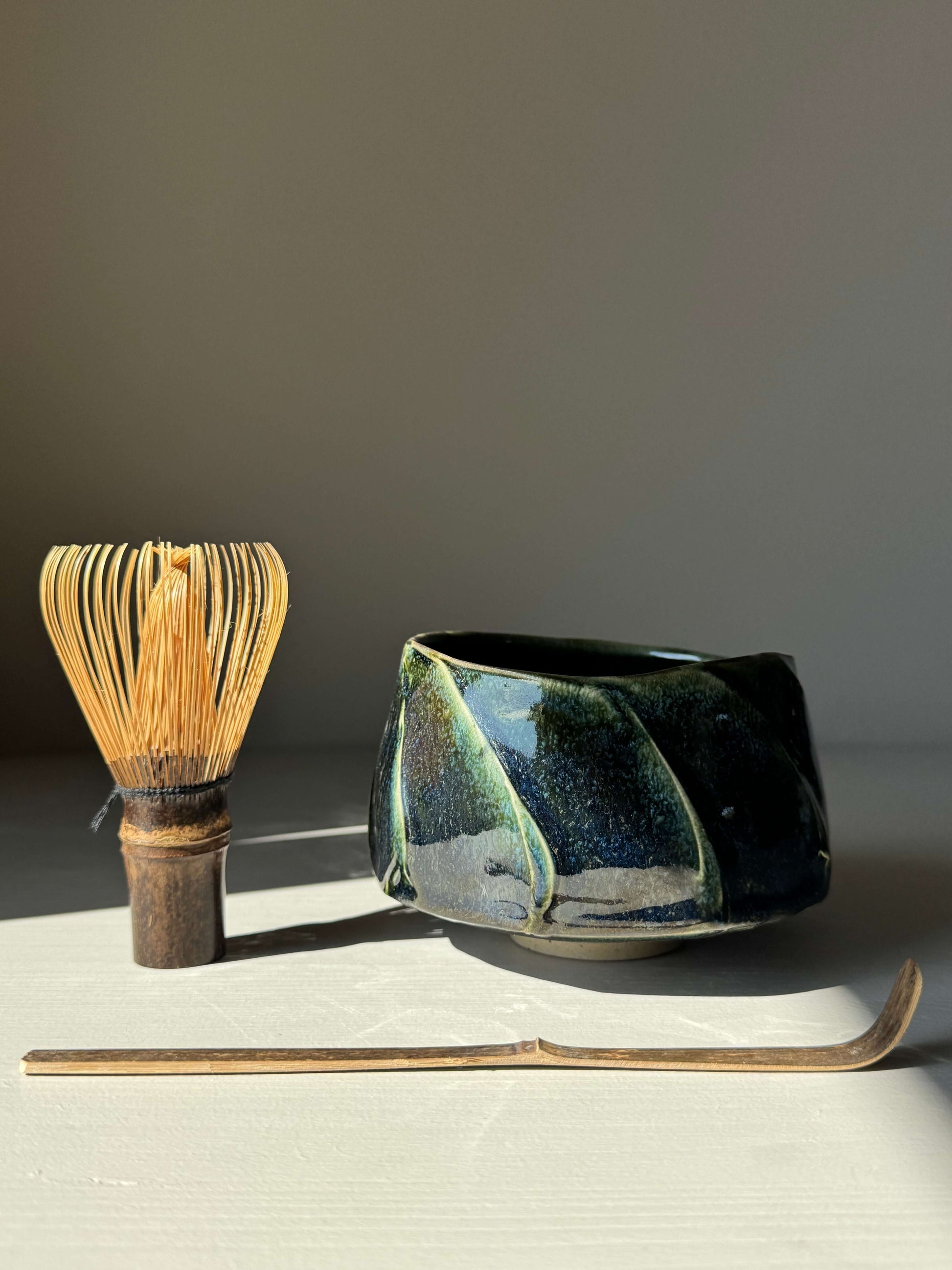 Textured Matcha Bowl - Hinoki Series #02 with whisk and scoop, handmade ceramic, green glazed and textured finish for matcha rituals.