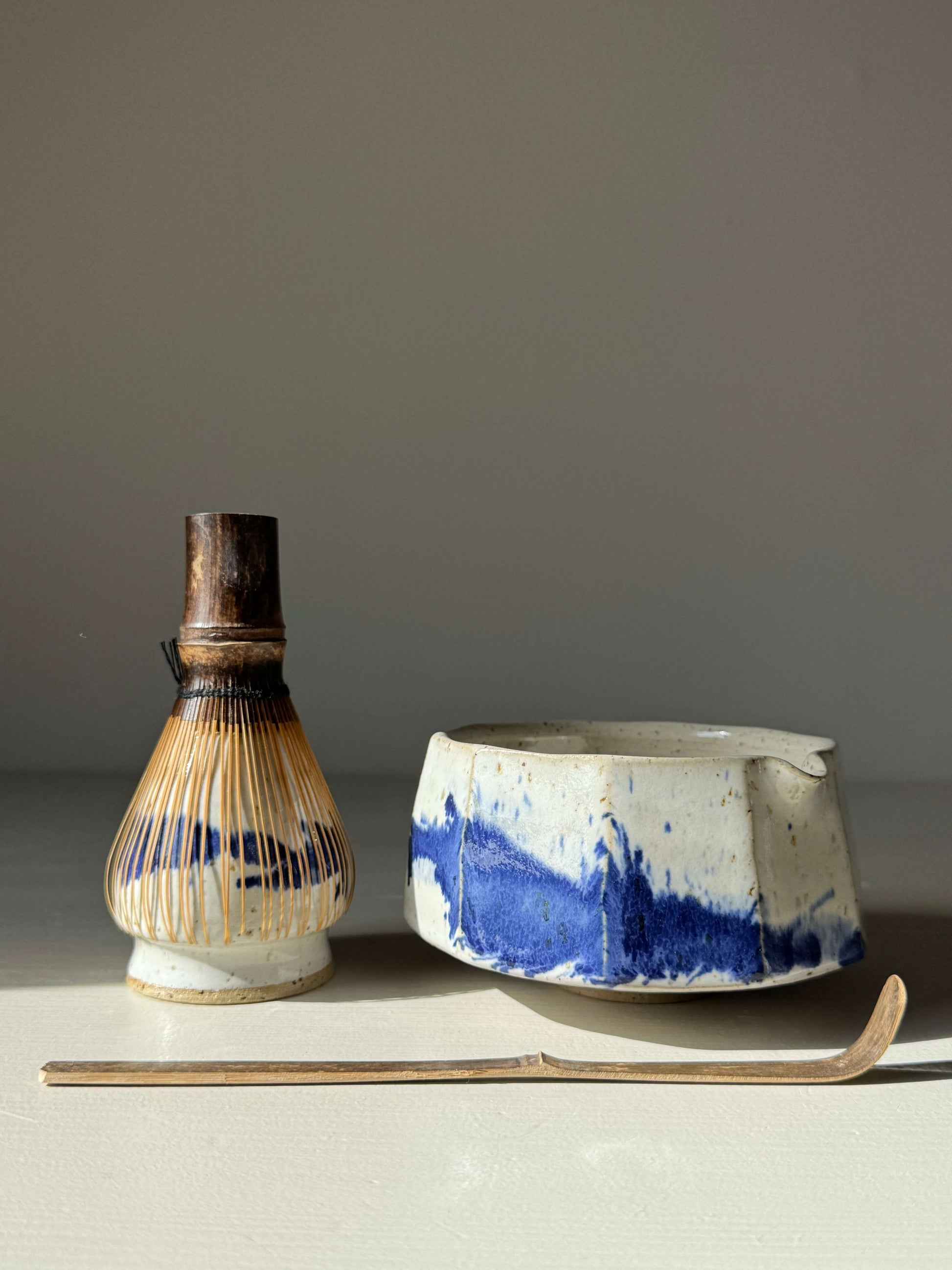 Faceted Matcha Bowl with Spout – Cobalt Blue & Glossy White Glaze #09, handmade ceramic bowl with whisk and spoon, modern aesthetic.