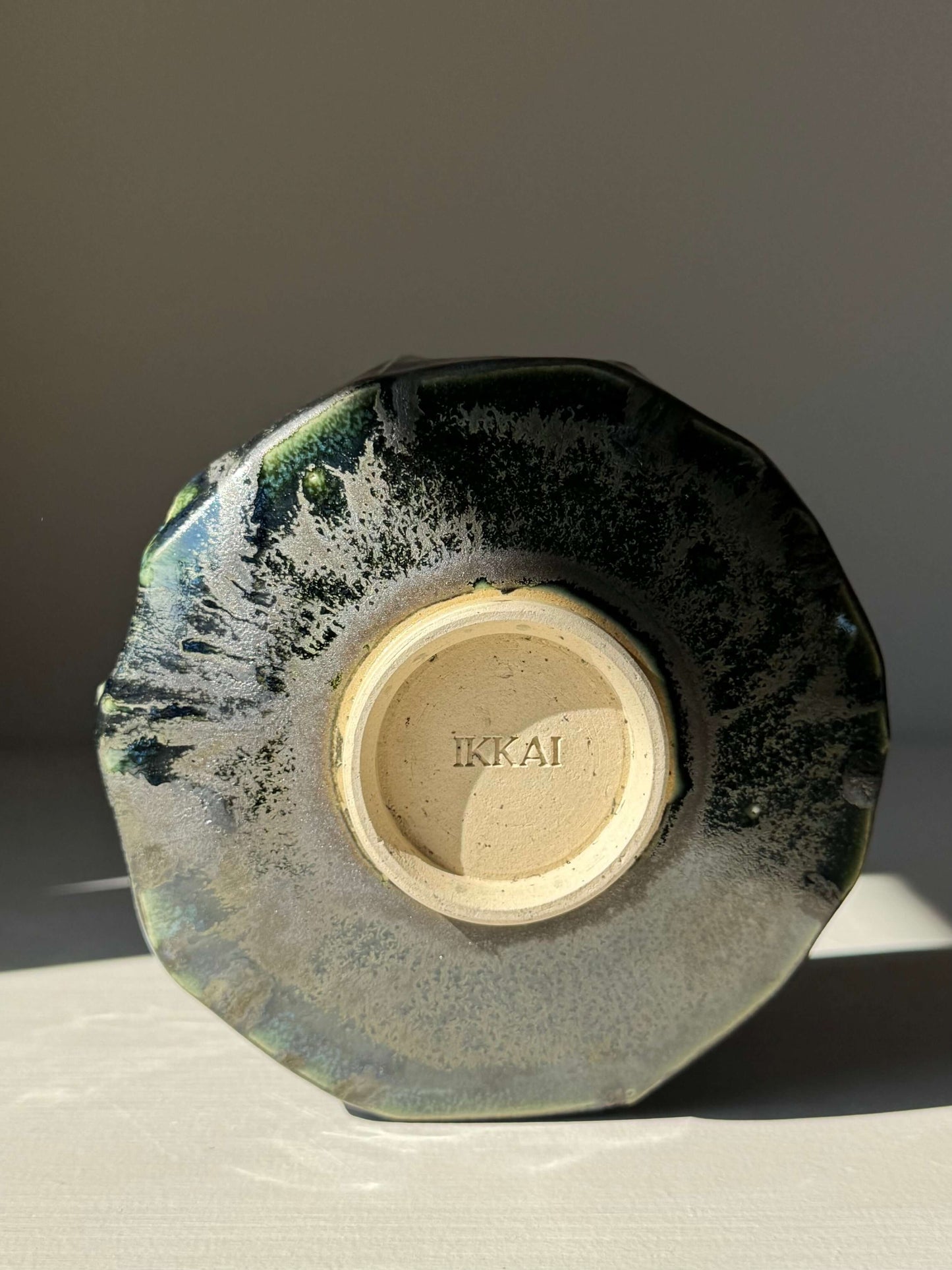 Base view of handmade ceramic Textured Matcha Bowl - Hinoki Series #02 with a unique green glaze and textured finish.