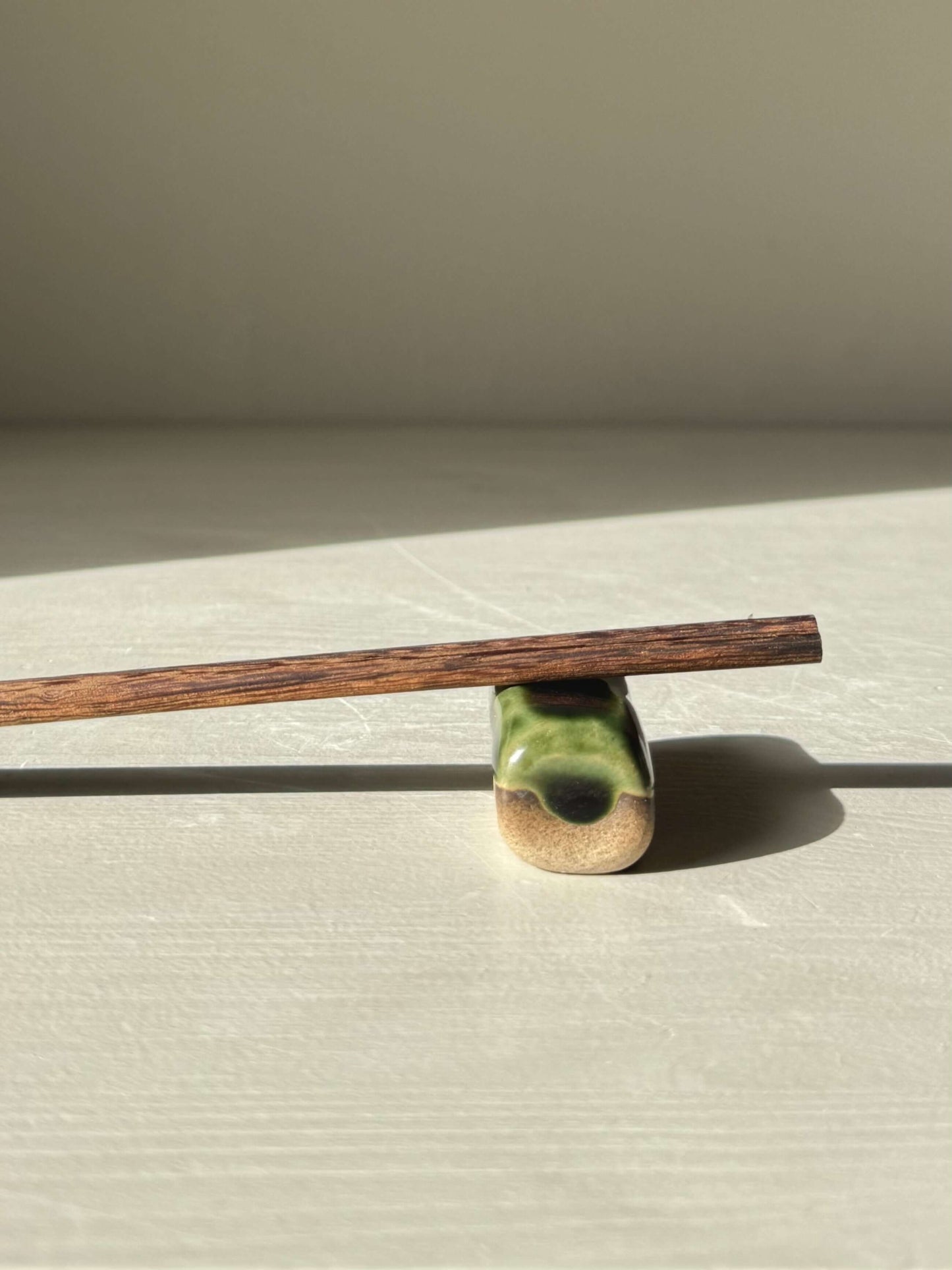 Chopstick/Spoon Rest – Mori in green glaze on toffee clay with chopsticks, perfect for serene meals and matching the Hinoki series.