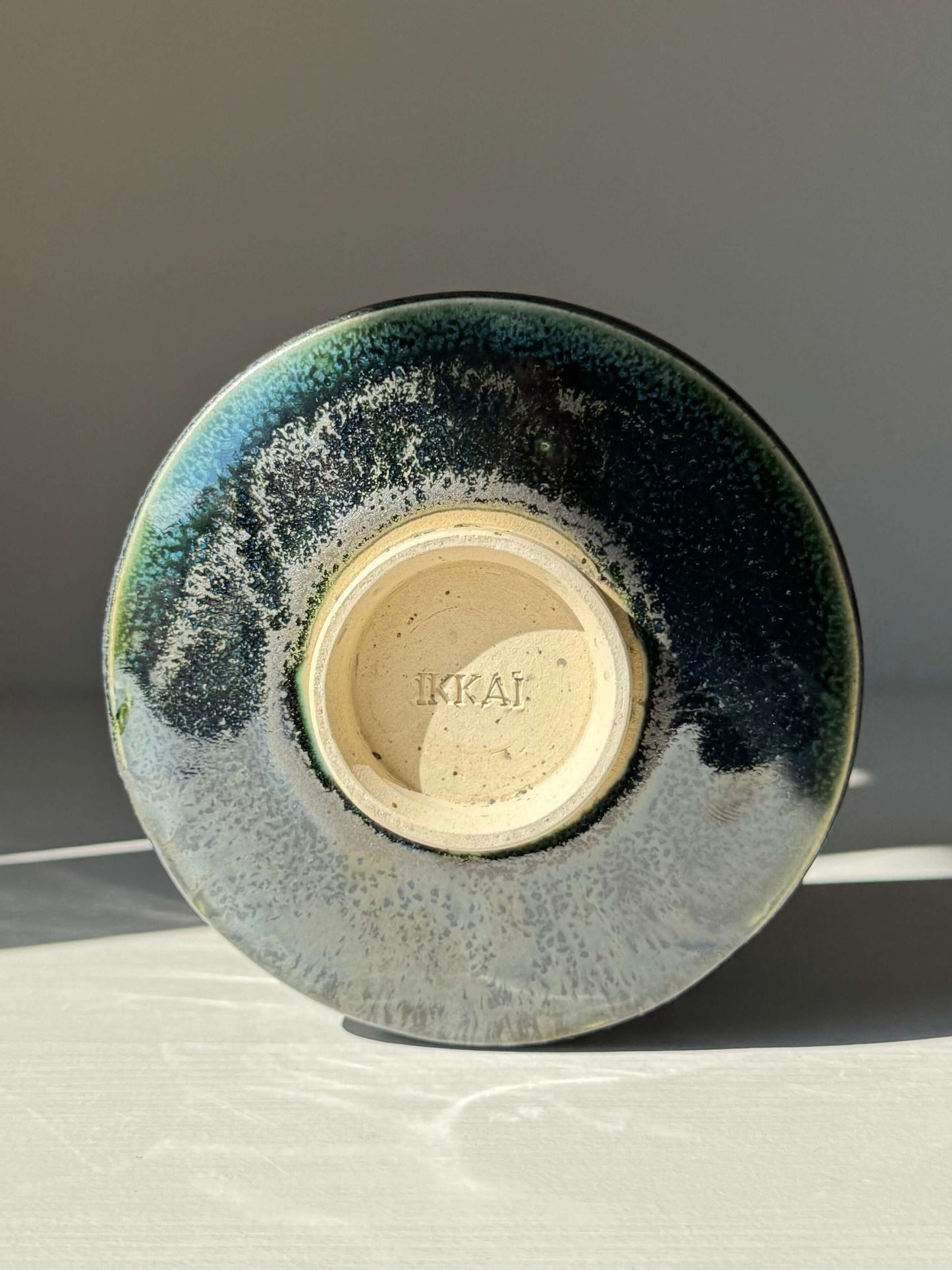 Base view of the Textured Matcha Bowl - Hinoki Series #04, highlighting the handmade ceramic design with green glaze and textured finish.