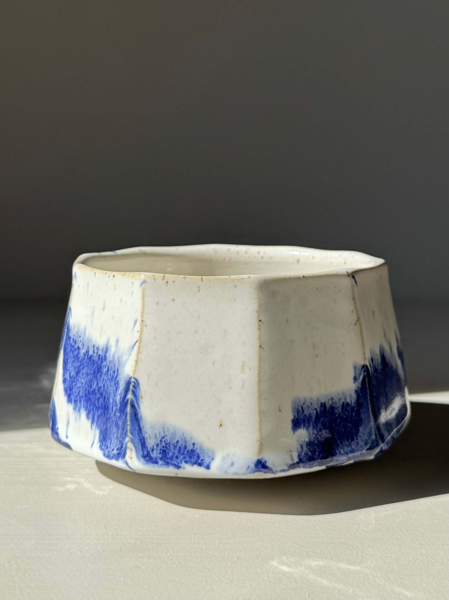 Handmade ceramic Faceted Matcha Bowl – Cobalt Blue & Glossy White Glaze #03 with bold, textured design and cobalt blue accents.