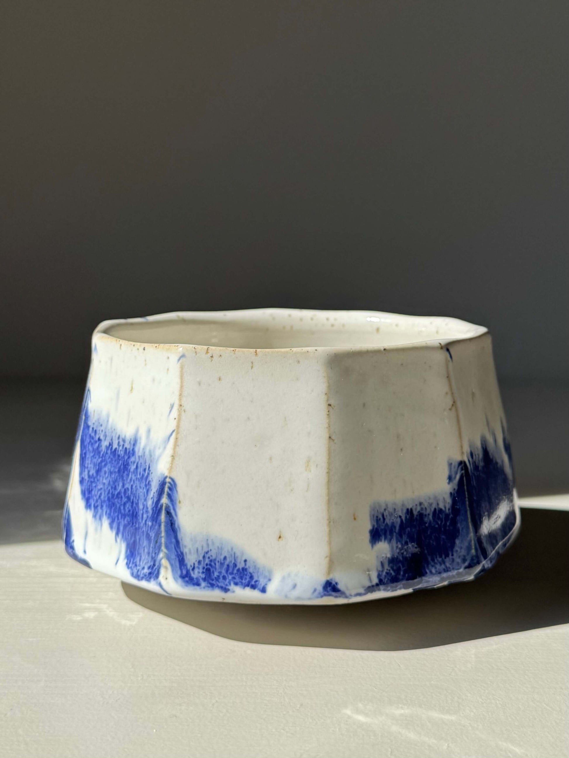 Handmade ceramic Faceted Matcha Bowl – Cobalt Blue & Glossy White Glaze #03 with bold, textured design and cobalt blue accents.