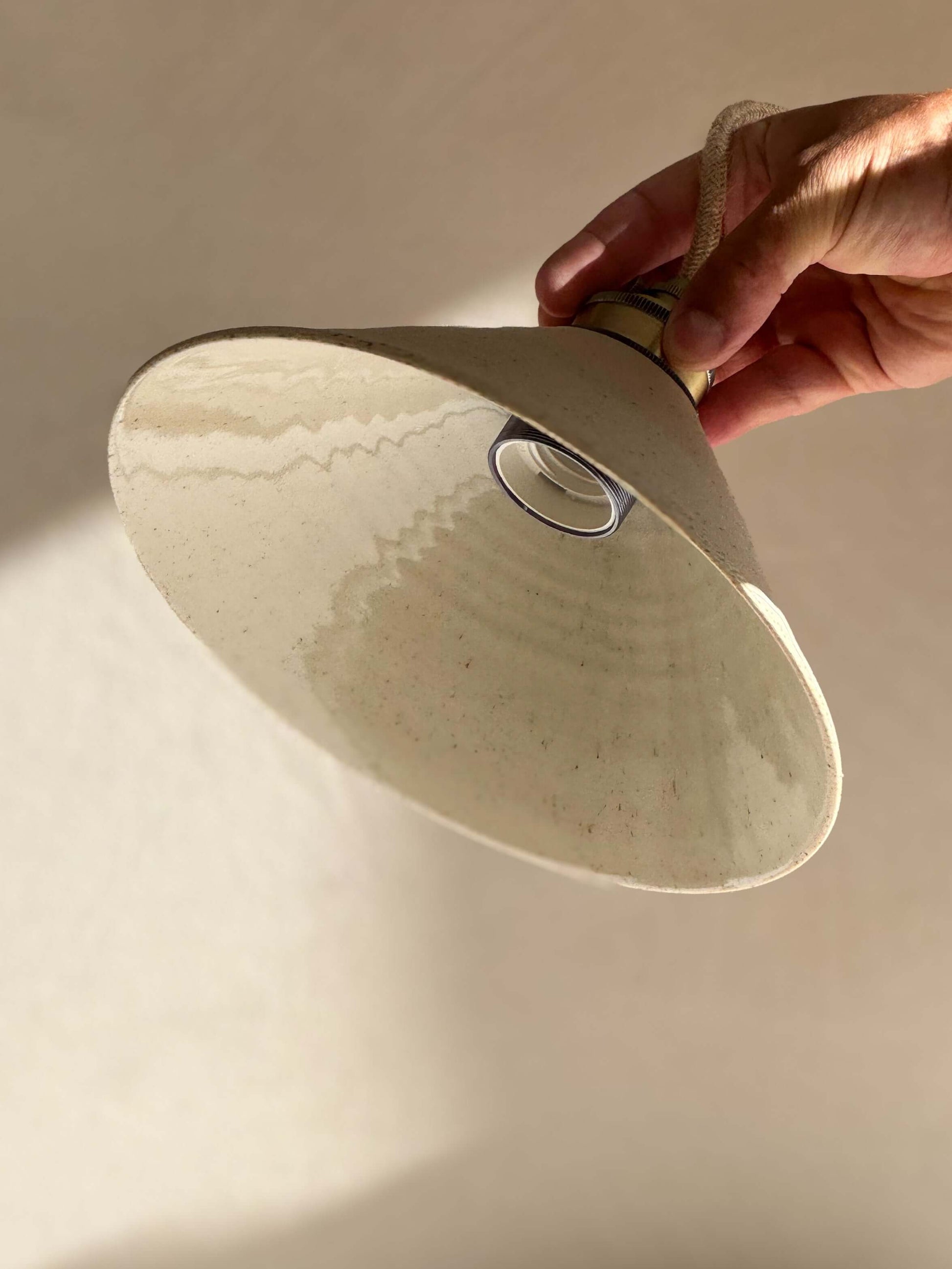 Handmade Ceramic Lamp Shade – Half Clear Glaze #01 with unglazed exterior and clear glazed interior, creating cozy light reflection.