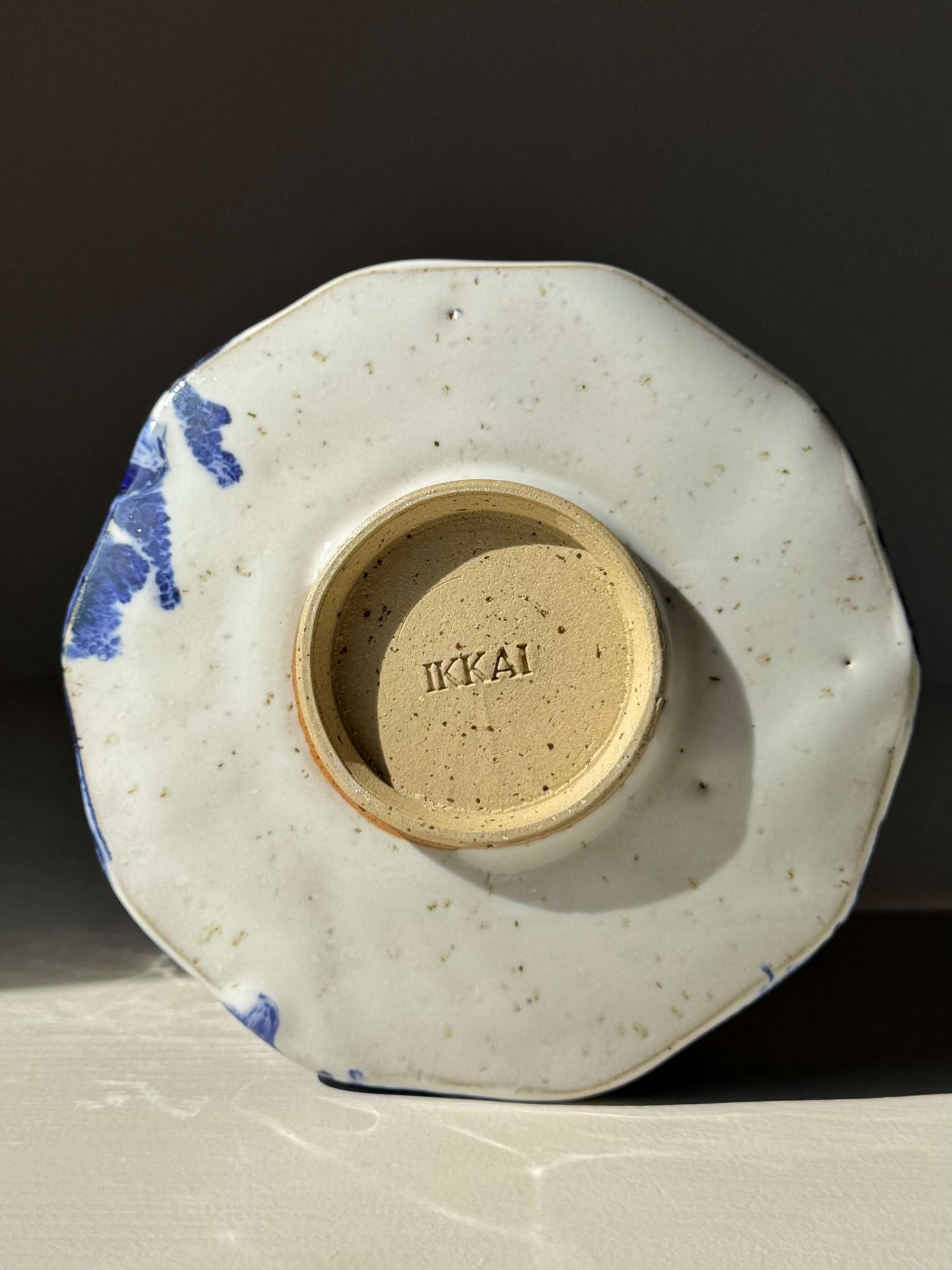 Bottom view of Faceted Matcha Bowl with Spout – Cobalt Blue & Glossy White Glaze #04, showcasing handmade ceramic design.
