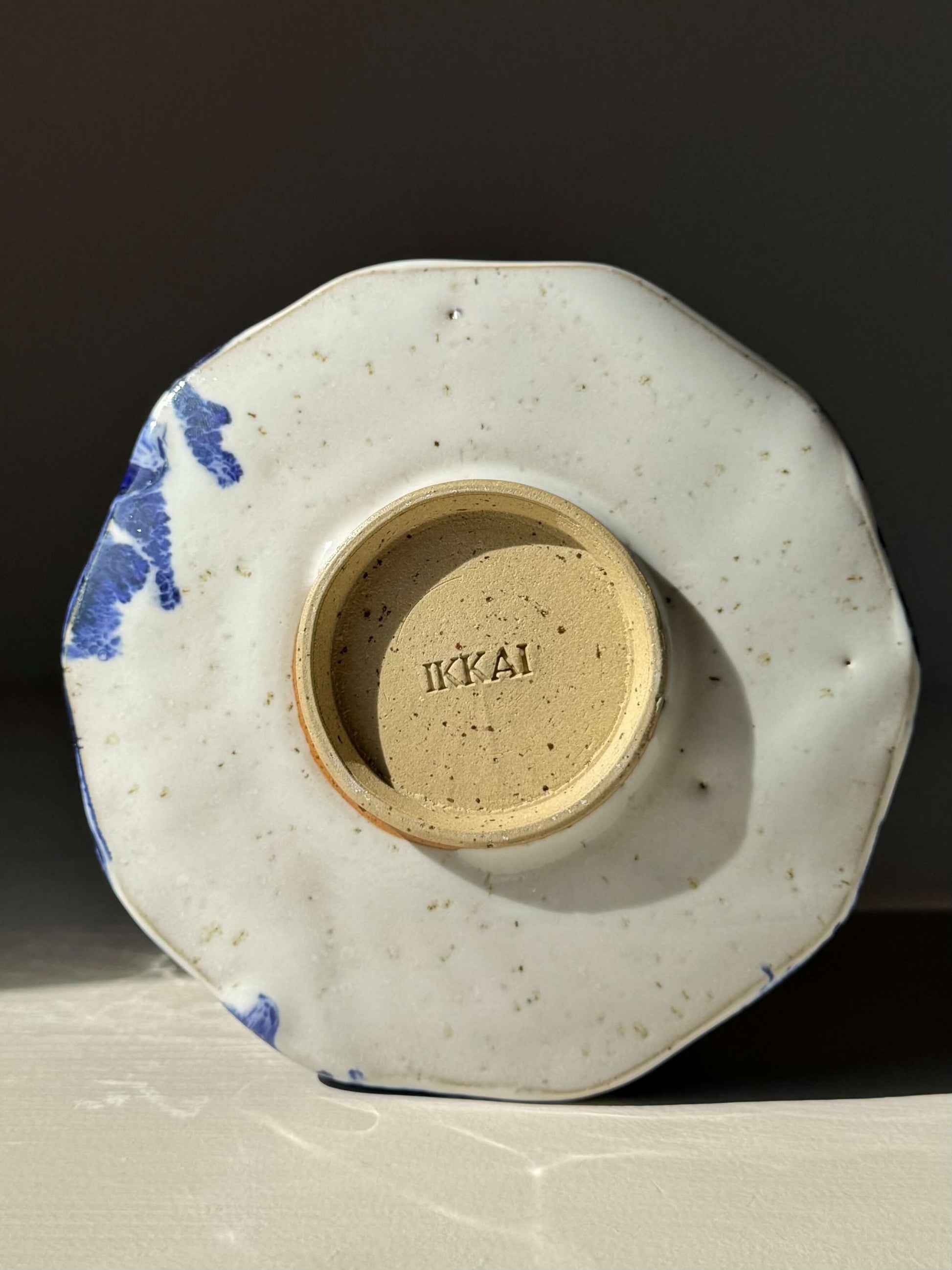 Bottom view of Faceted Matcha Bowl with Spout – Cobalt Blue & Glossy White Glaze #04, showcasing handmade ceramic design.