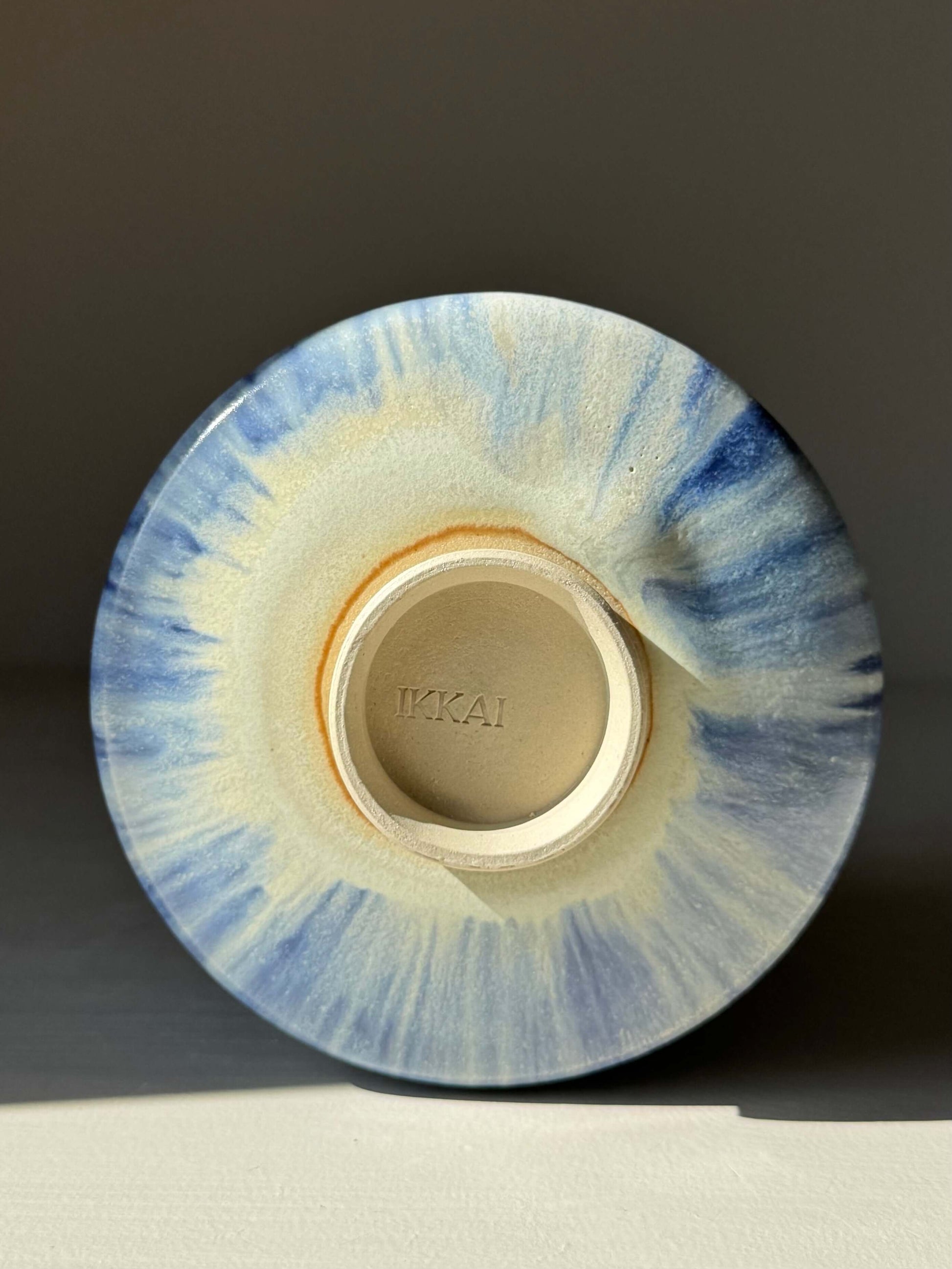 Base view of handmade ceramic Matcha bowl - Cobalt Blue & Moonstone Glaze #01, showcasing unique glaze pattern and artisan craftsmanship.