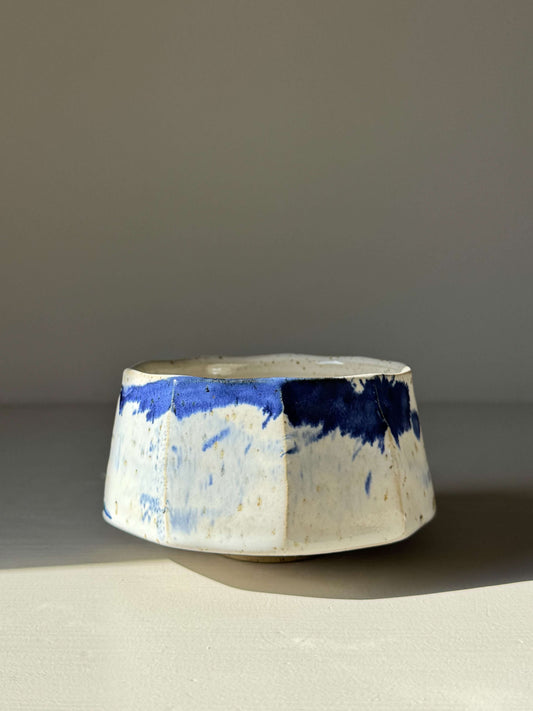 Handmade ceramic Faceted Matcha Bowl – Cobalt Blue & Glossy White Glaze #05 with textured facets and cobalt blue splashes.