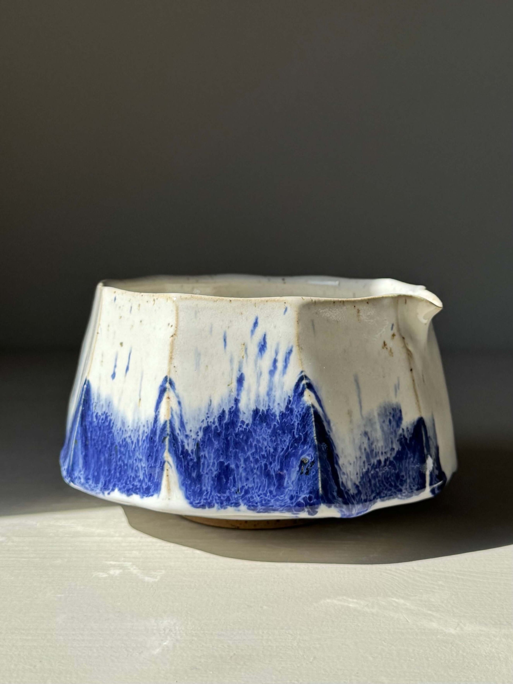 Handmade ceramic Faceted Matcha Bowl with Spout – Cobalt Blue & Glossy White Glaze #04 with unique hand-splashed design.
