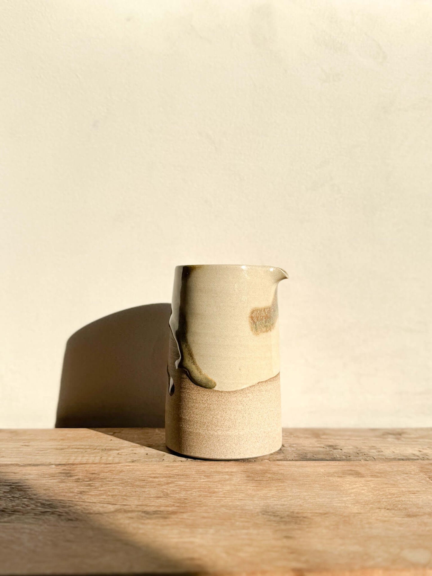 Inyo Series #02 sculptural vase with raw texture and flowing glaze, usable as a vase, water jug, or studio tool holder.