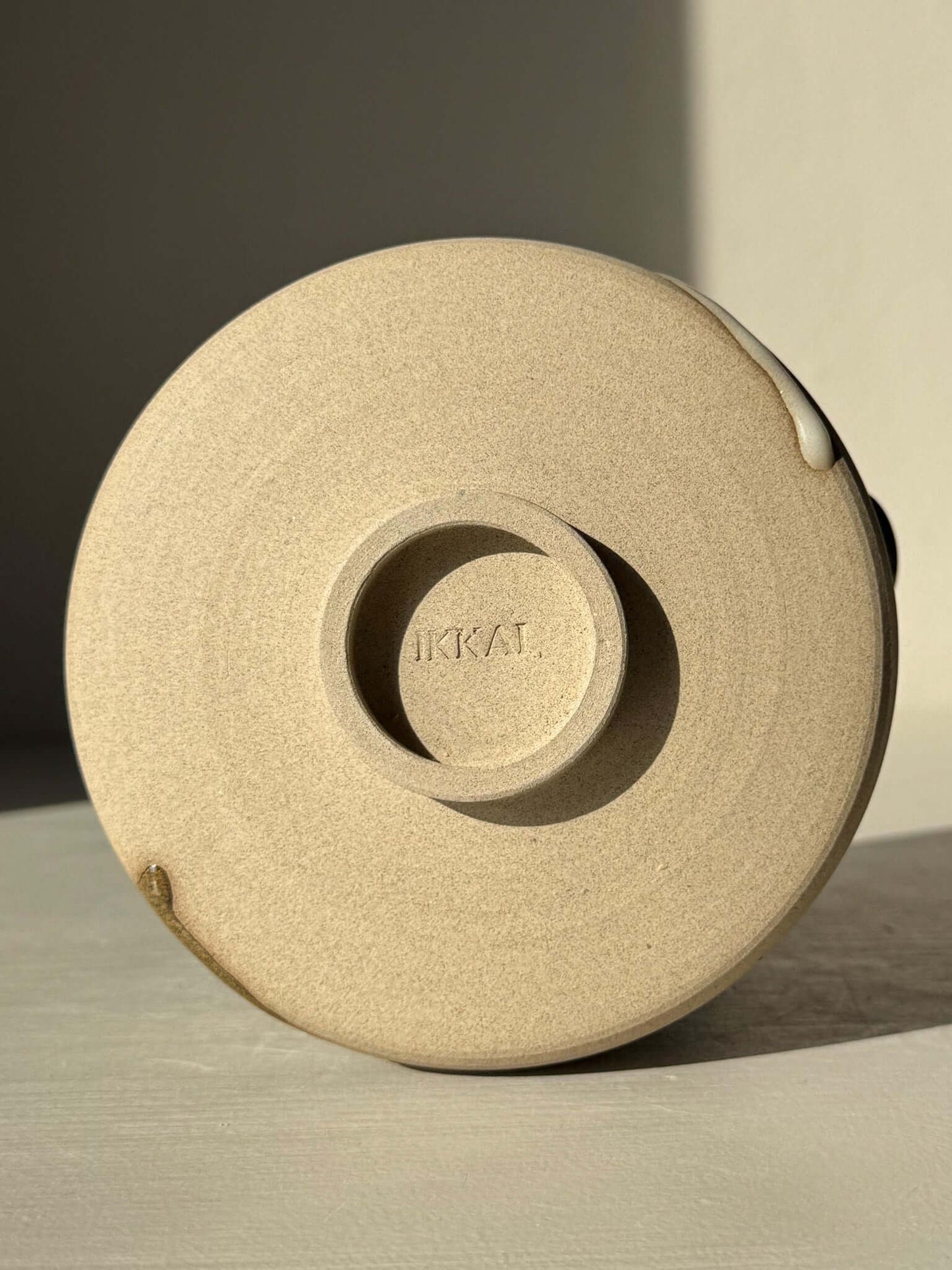 Matcha Bowl with Spout – Inyo #12 showing the bottom view with logo and natural stoneware texture.