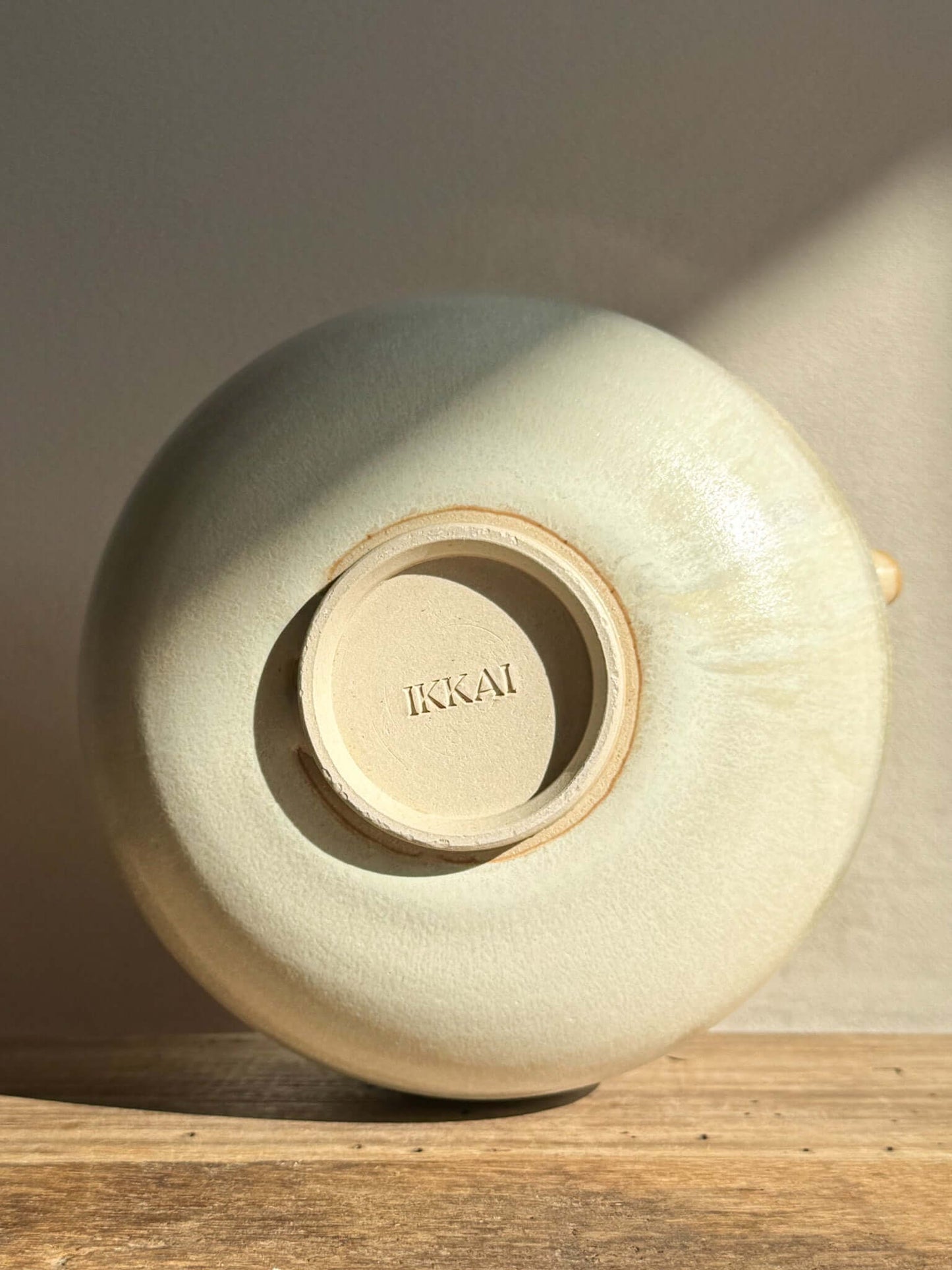 Bottom view of Katakuchi Matcha Bowl with Moonstone glaze, showcasing the spout and signature base, highlighting traditional craftsmanship.