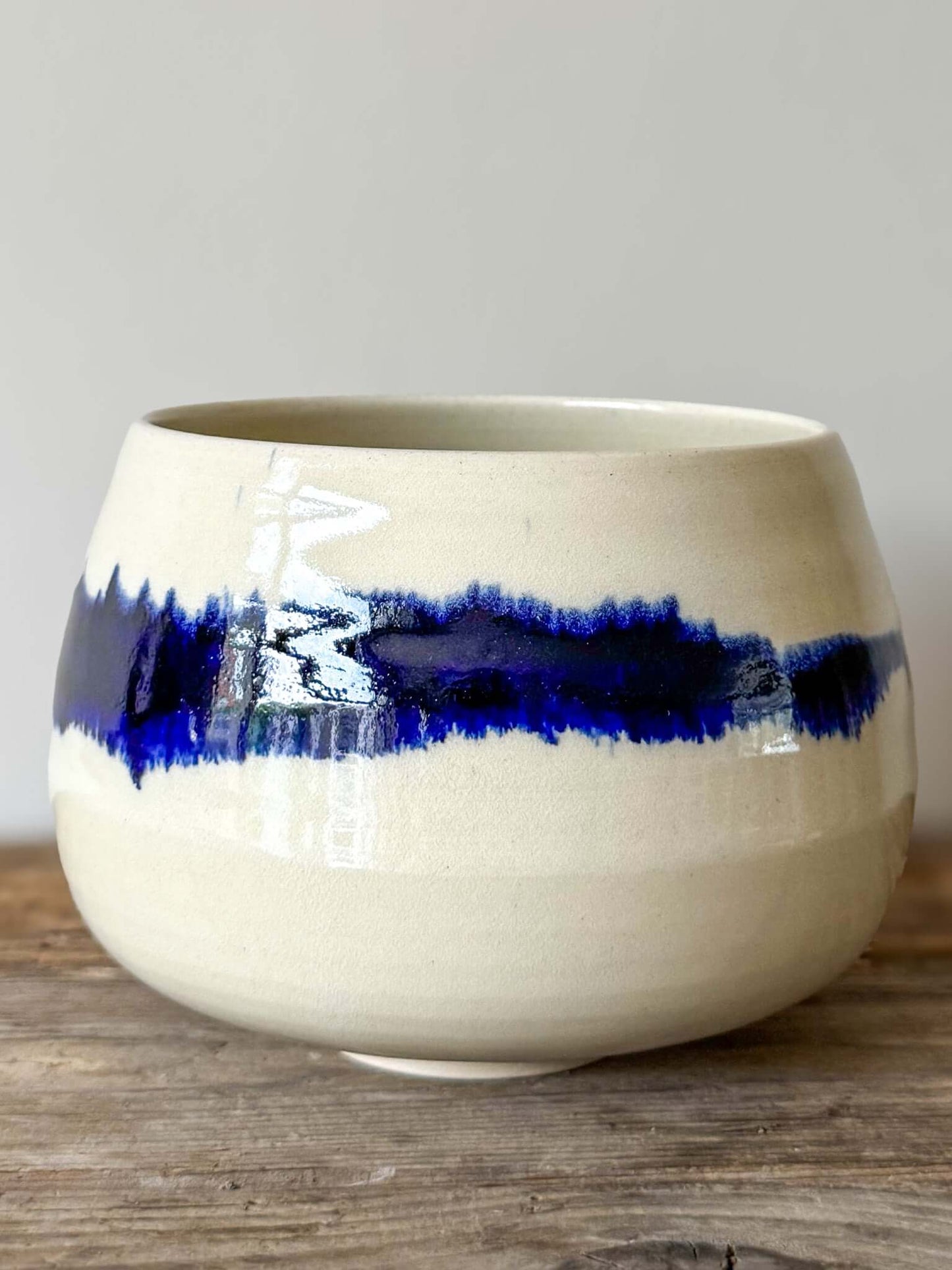 Large Rounded Matcha Bowl from the Gosu Series, featuring a cobalt glaze band resembling distant mountains, soft curves, and grounding shape.