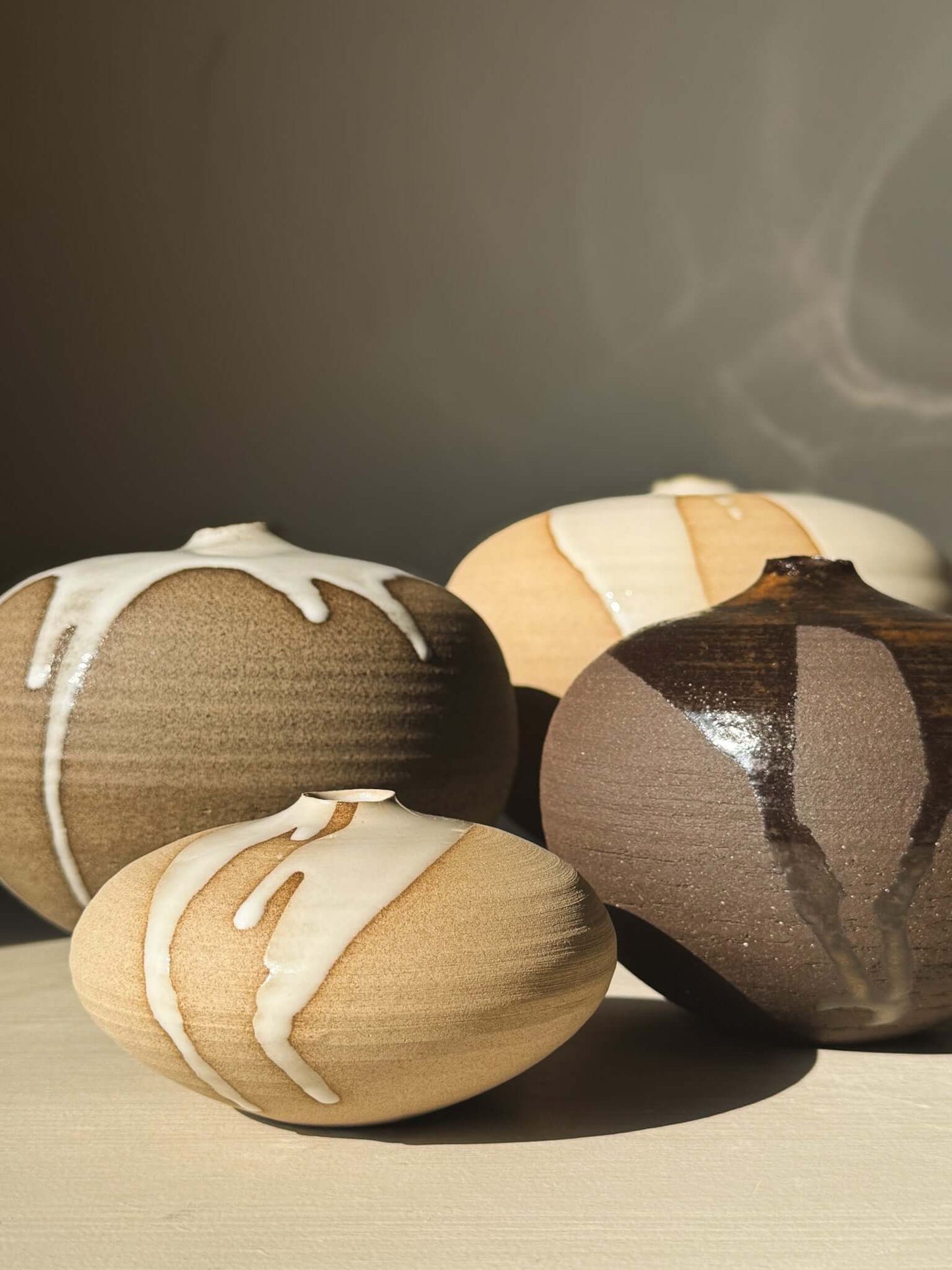 Four Orb Vase – #17 with unique glaze patterns and rounded shapes, showcasing a calm, sculptural presence.