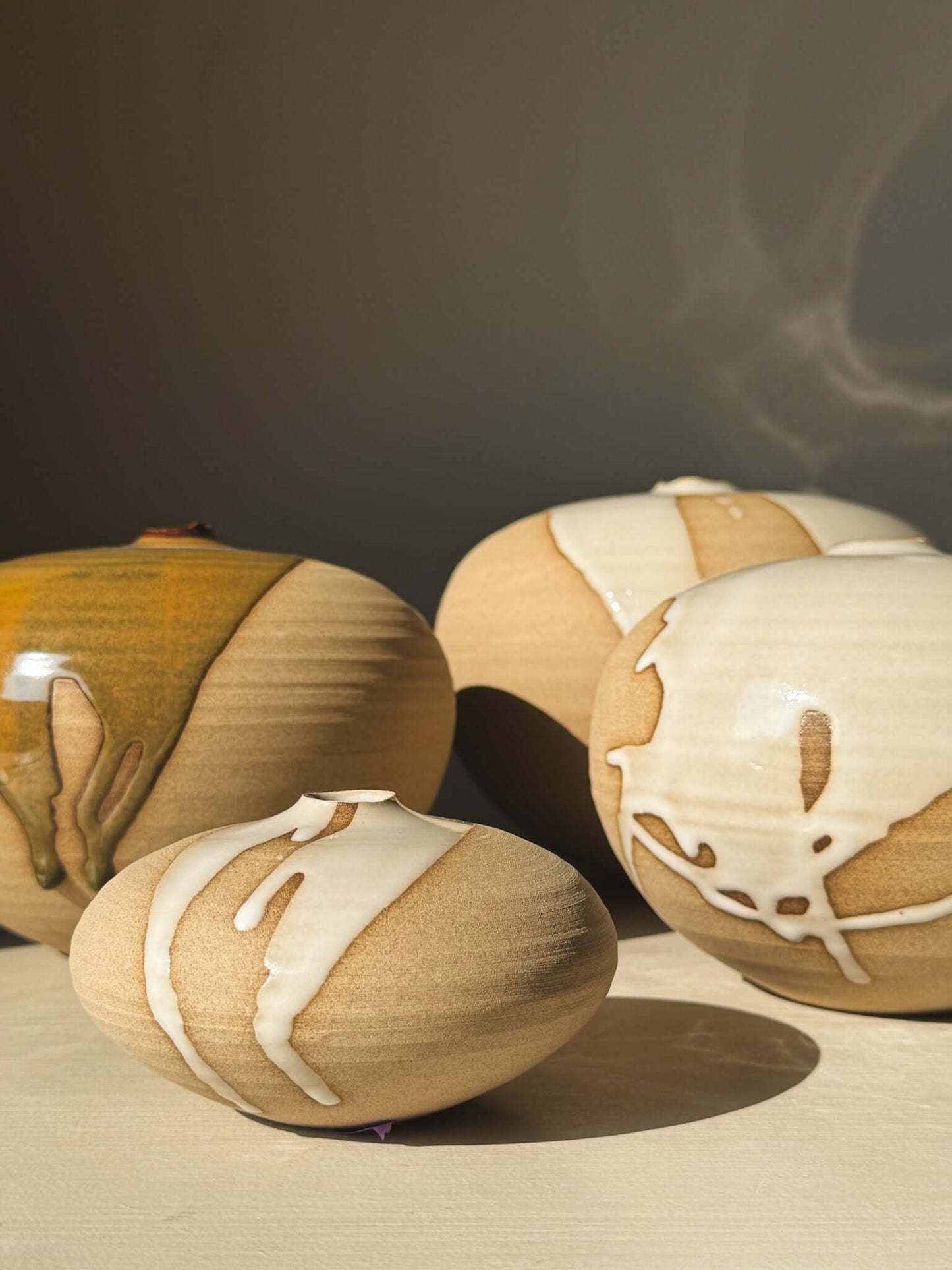 Orb Vase – #16 showcasing unique glaze patterns and sculptural soft spherical form.