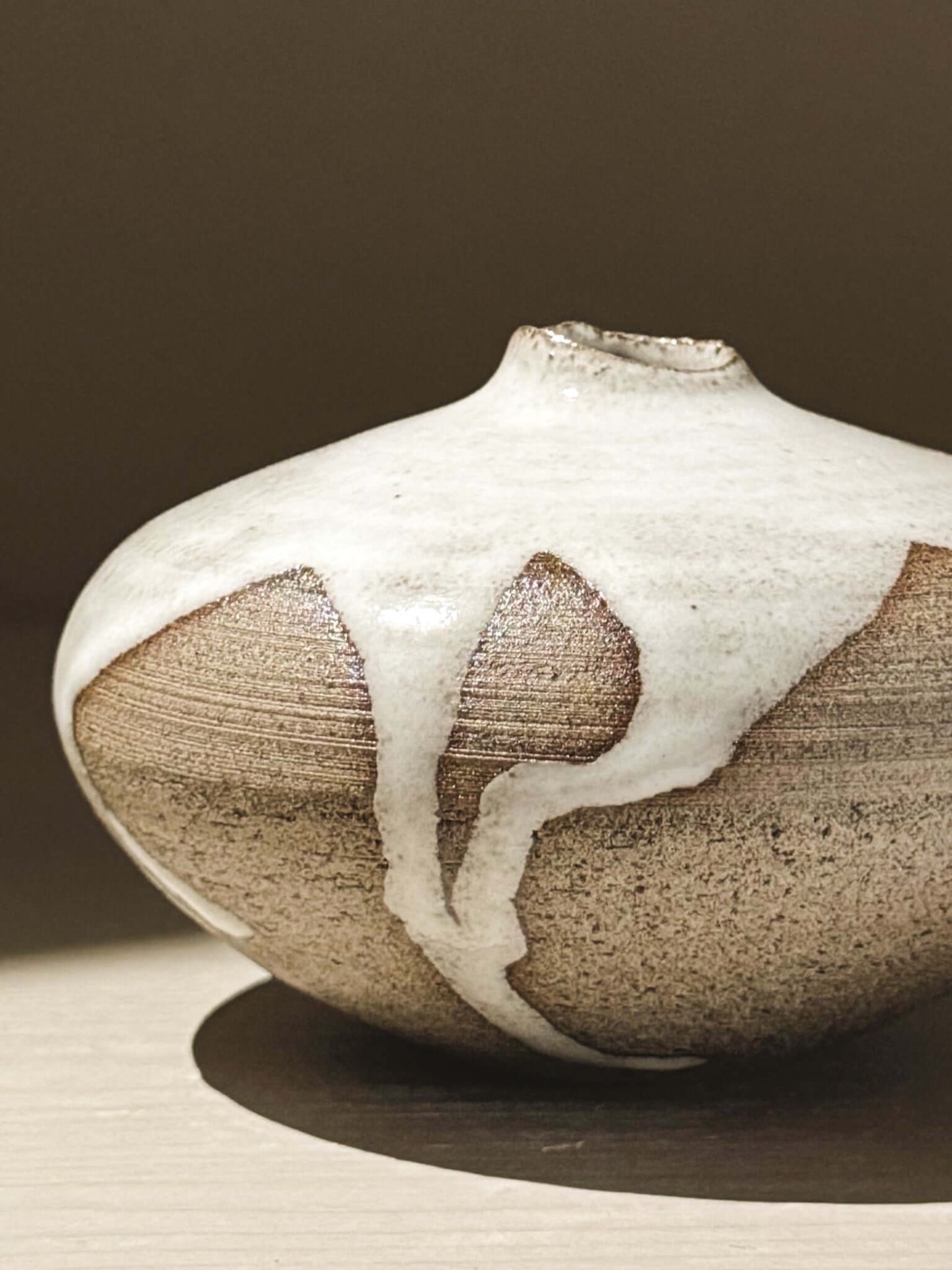 Orb Vase – Yuki Ash #10, a unique Japanese handmade ceramic orb vase with organic glaze patterns.