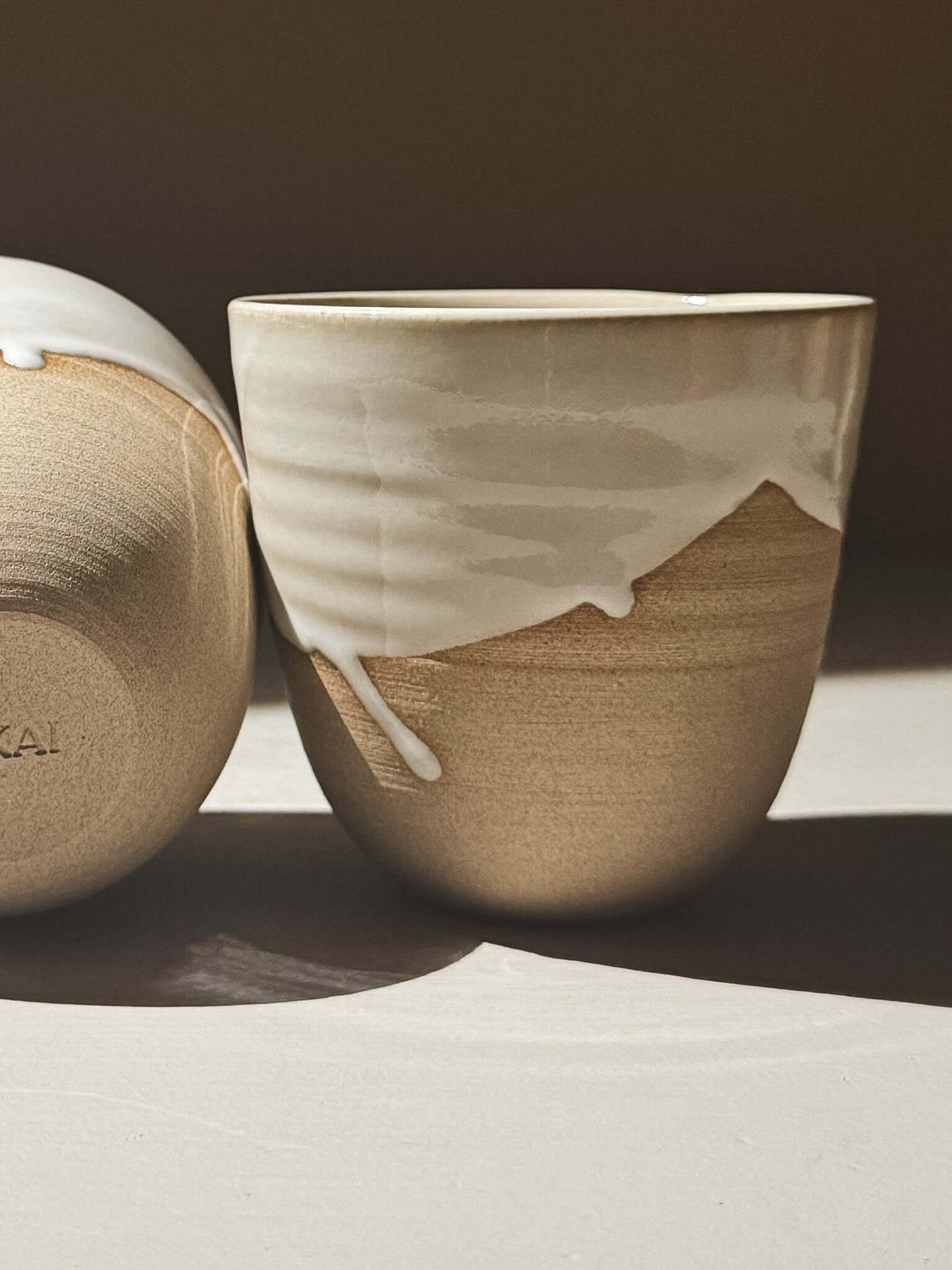 Stackable Latte Cups - Yuki with glossy white glaze and warm toffee clay, showcasing handmade craftsmanship.