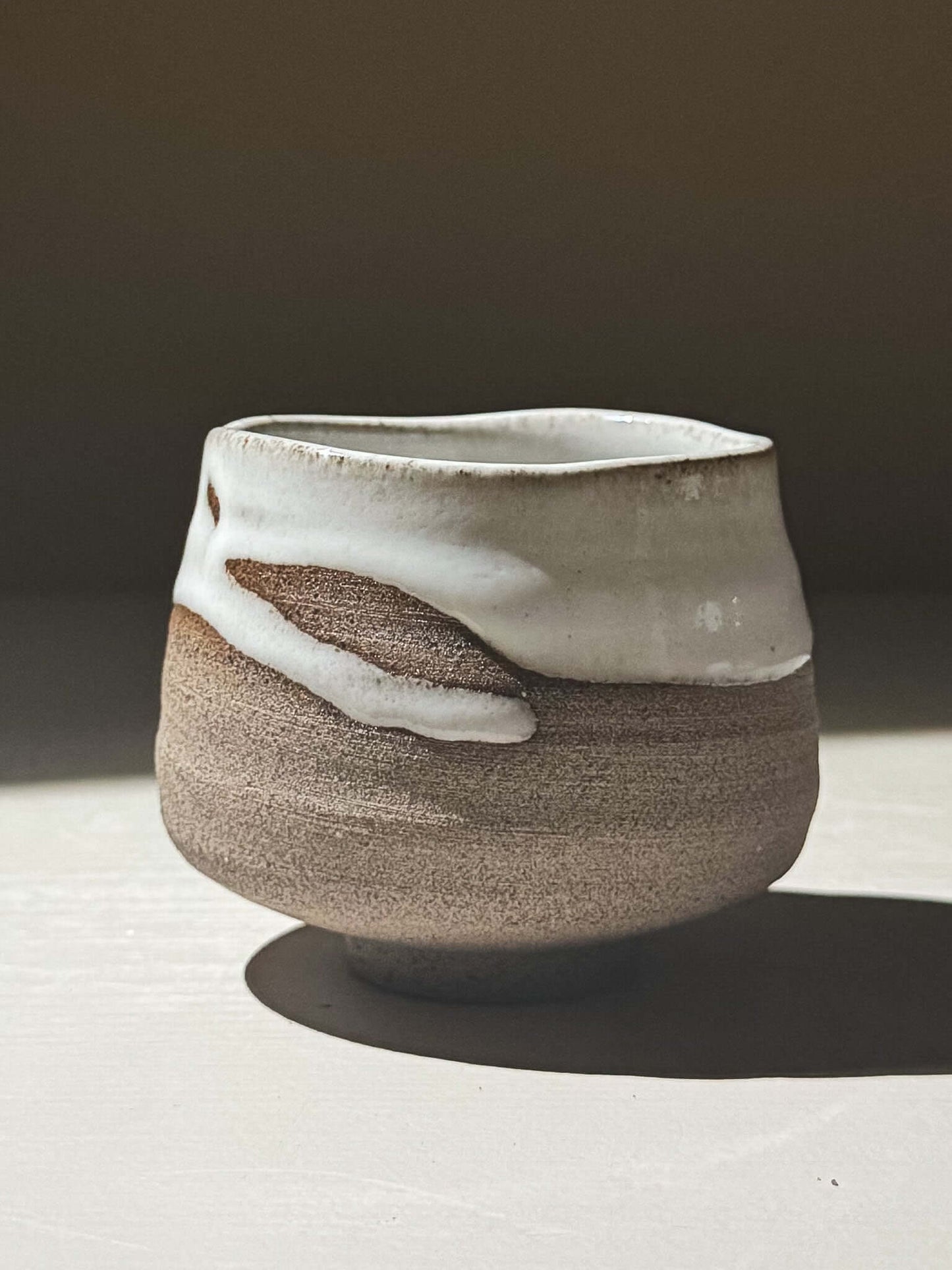 Yunomi Cup - Yuki Ash #03 featuring a textured clay body with glossy white glaze, handmade and unique.