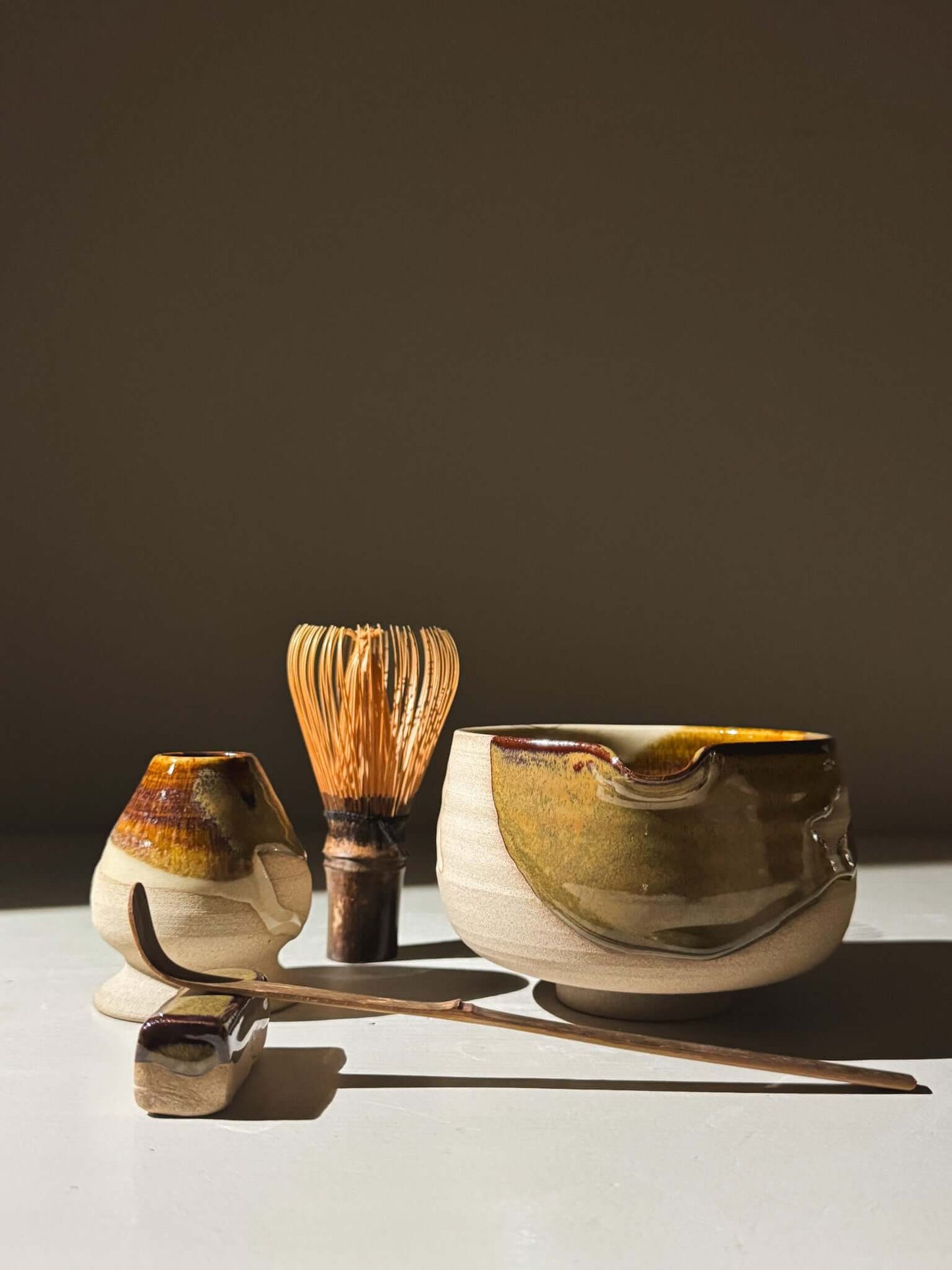 Handmade Matcha Bowl with Spout – Inyo #04 with whisk and spoon on display.