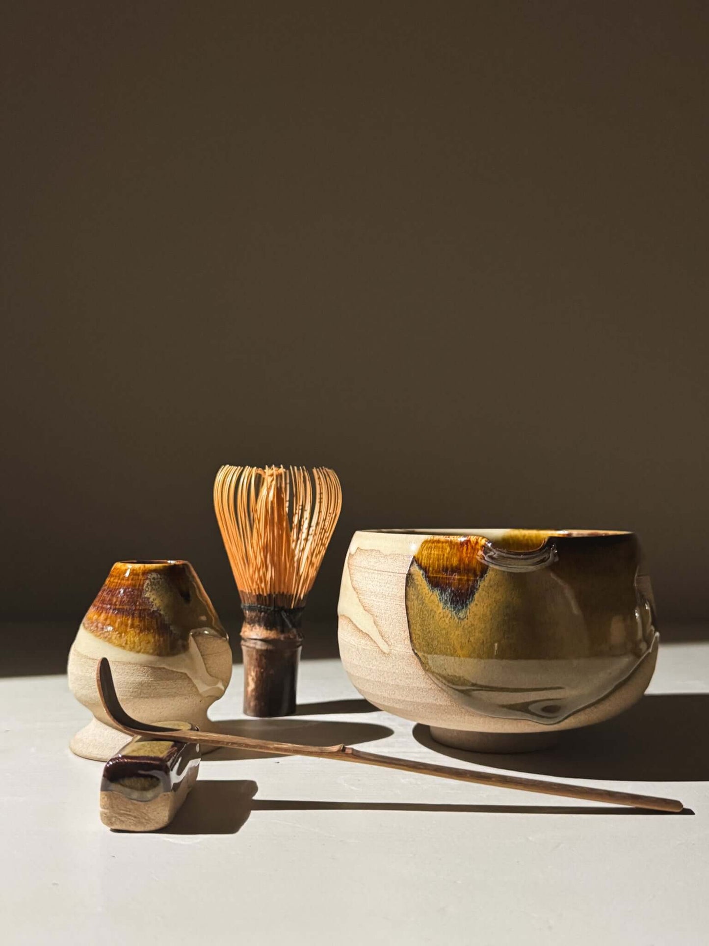 Matcha Bowl with Spout – Inyo #07 set with bamboo whisk and scoop on stoneware surface