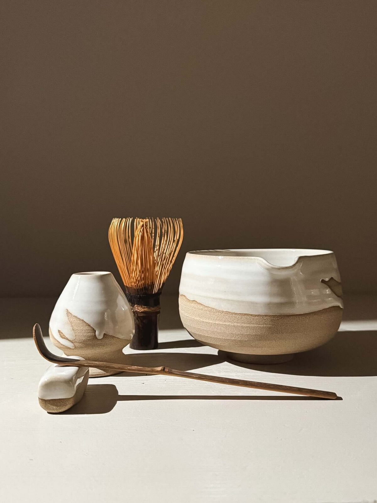 Matcha Bowl with Spout – Yuki #06 with toffee clay and white glaze, part of the Yuki Series, handcrafted for a serene tea ritual.