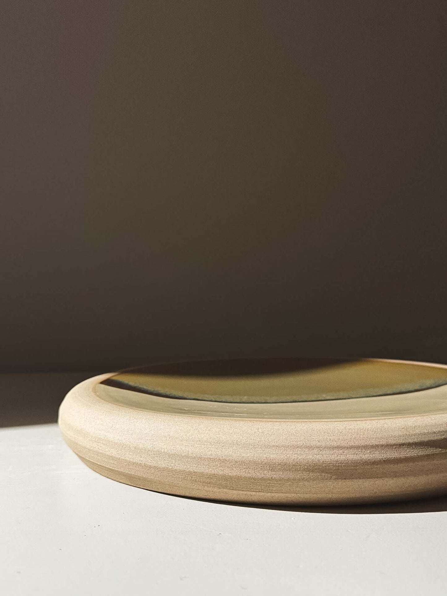 Large Serving Platter - Inyo #01 featuring a unique toffee-colored stoneware with landscape-like glaze pattern under bright lighting.