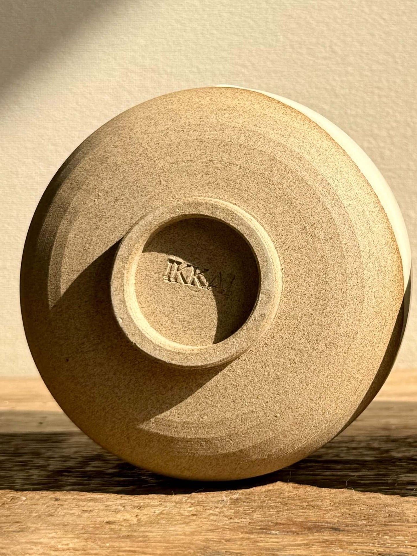 Bottom of handmade ceramic Coffee cups - Yuki Series, showing warm toffee clay texture and craftsmanship detail.