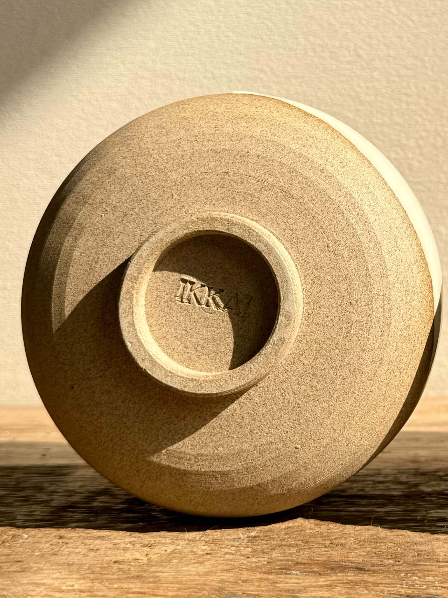 Bottom of handmade ceramic Coffee cups - Yuki Series, showing warm toffee clay texture and craftsmanship detail.