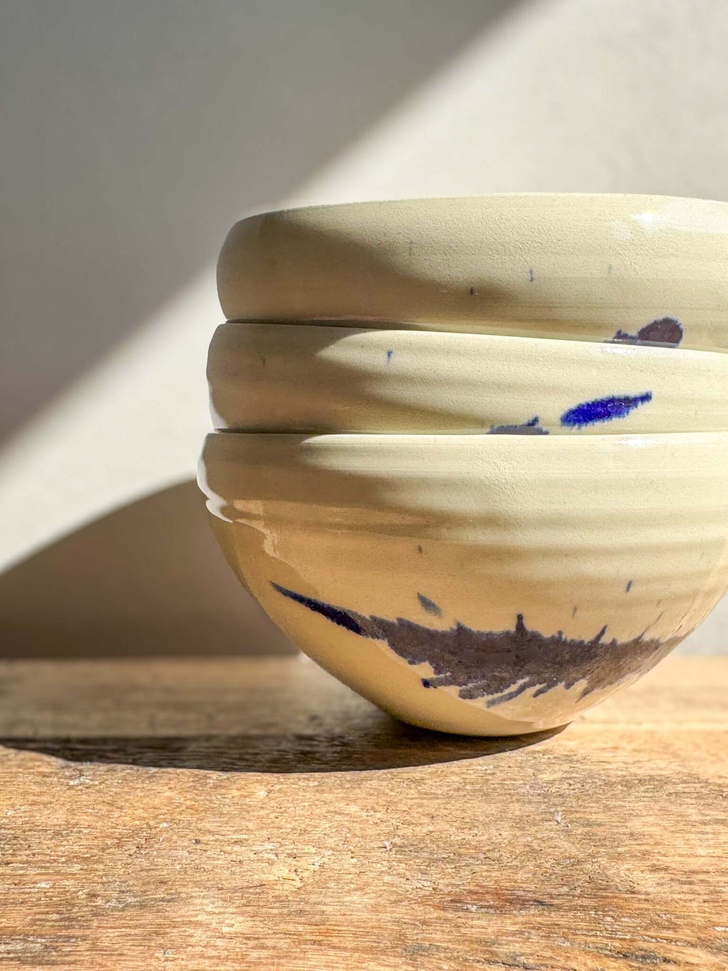 Stacked Gosu Series bowls with cobalt blue splashes on soft glaze, perfect for breakfast or small meals, displaying unique craftsmanship.