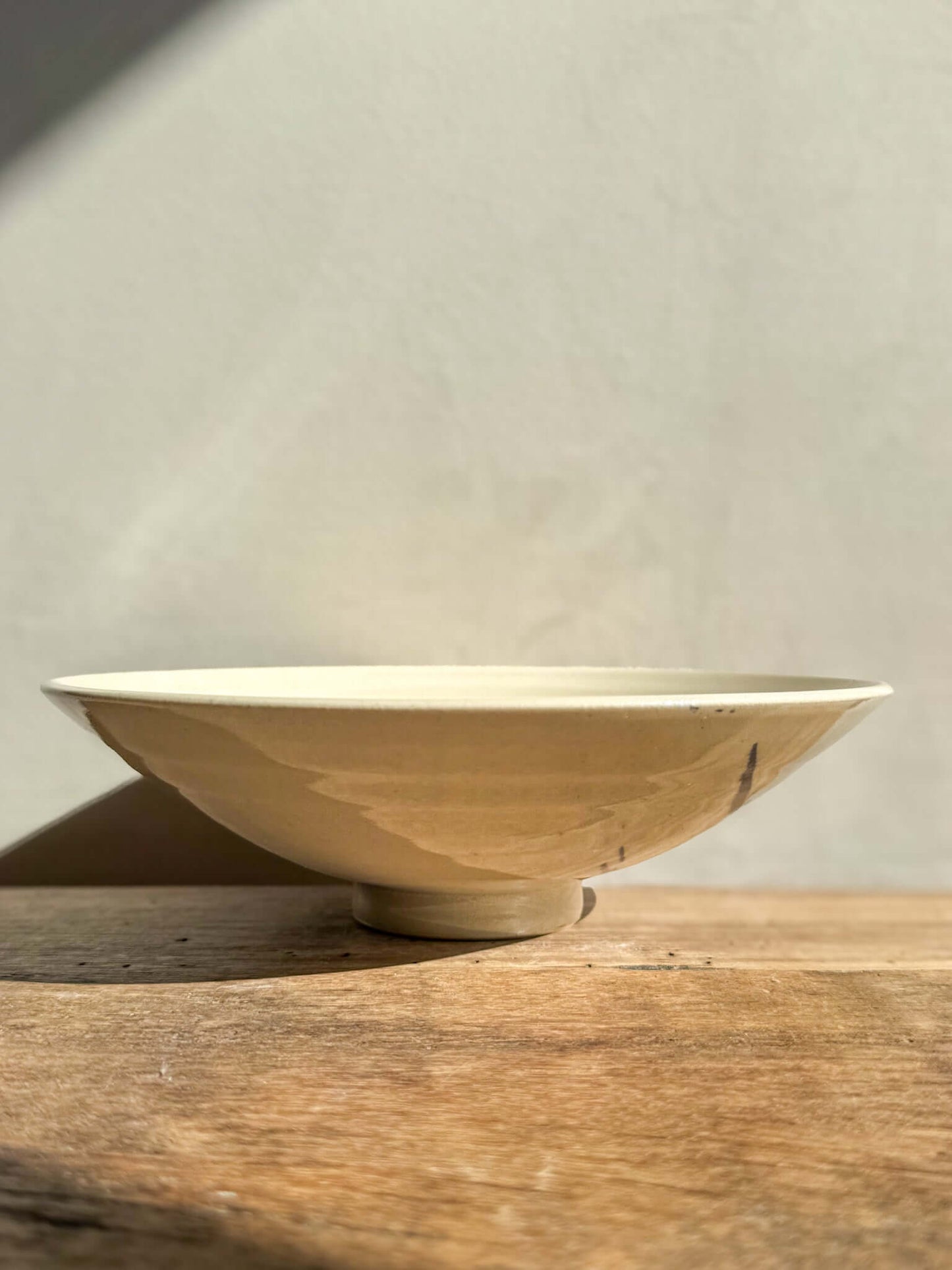 "Lidded Serving Bowl from Gosu Series in soft light, showcasing elegant design and natural textures on a wooden surface"