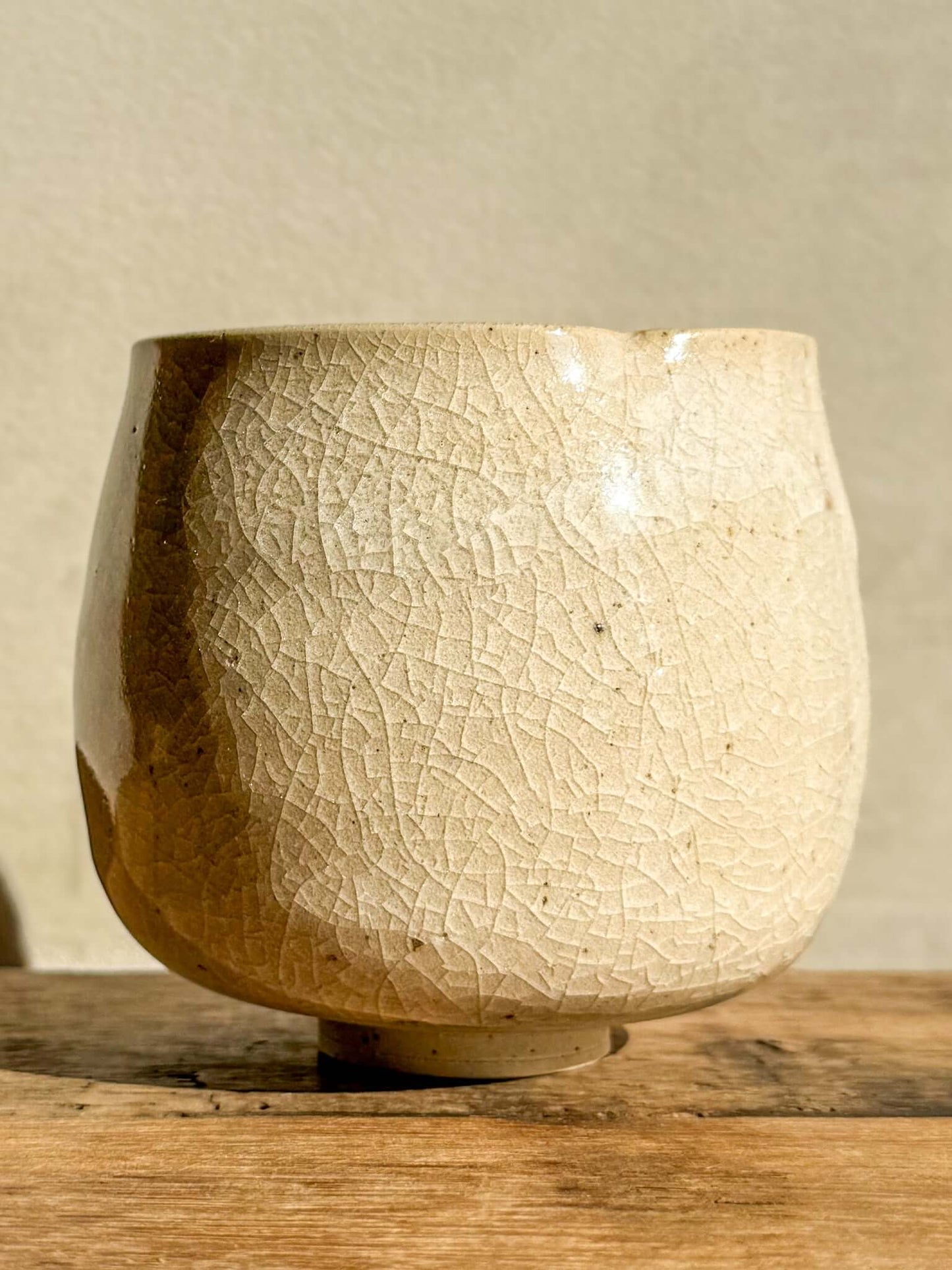 Yunomi Cup from Kannyū Series with transparent crackle glaze on wooden surface, featuring a delicate fine line pattern and softly flowing rim.