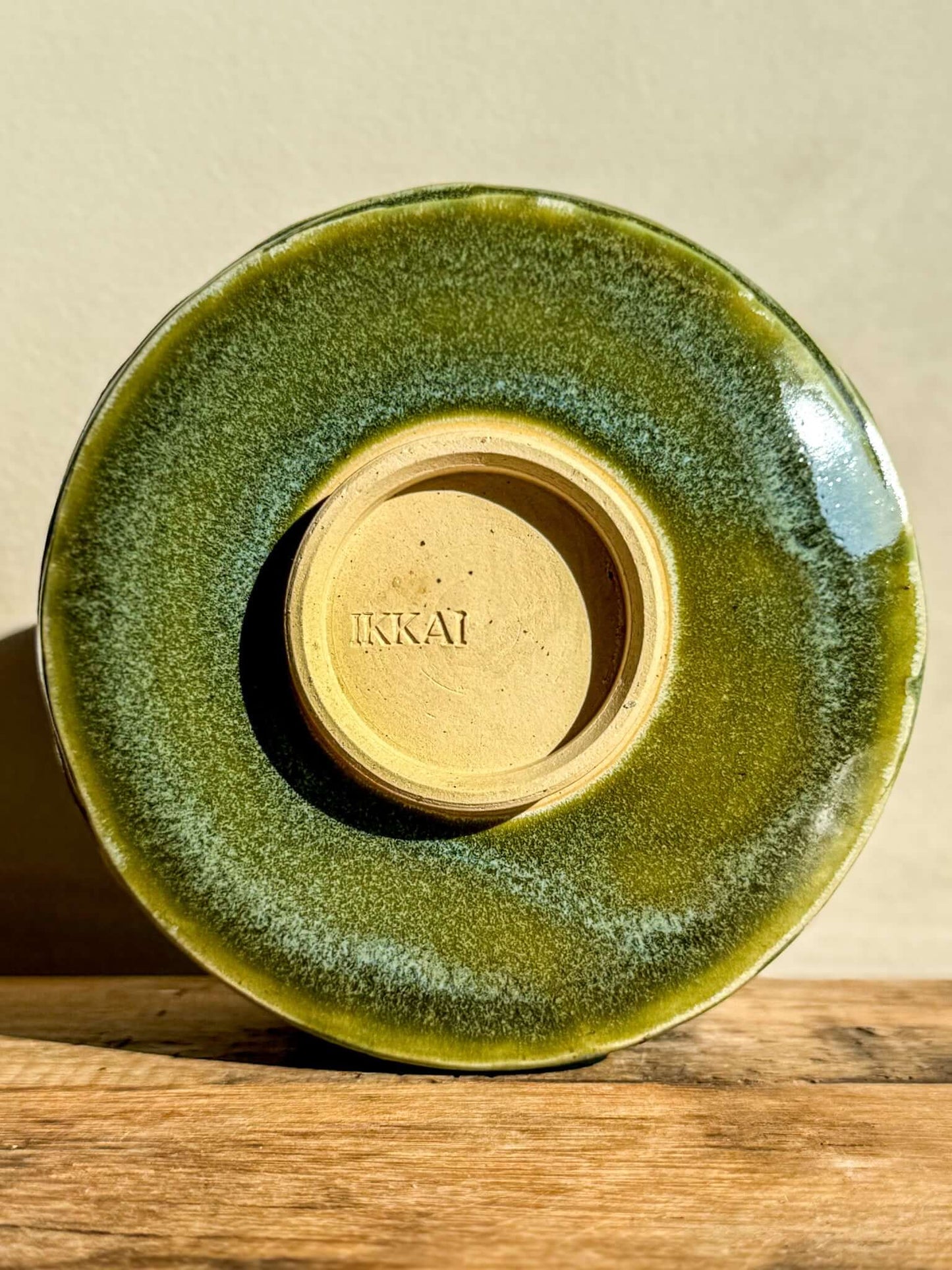 Wasabi Green Matcha Bowl with textured glaze and carved design, showcasing natural earthy tones and organic lines.